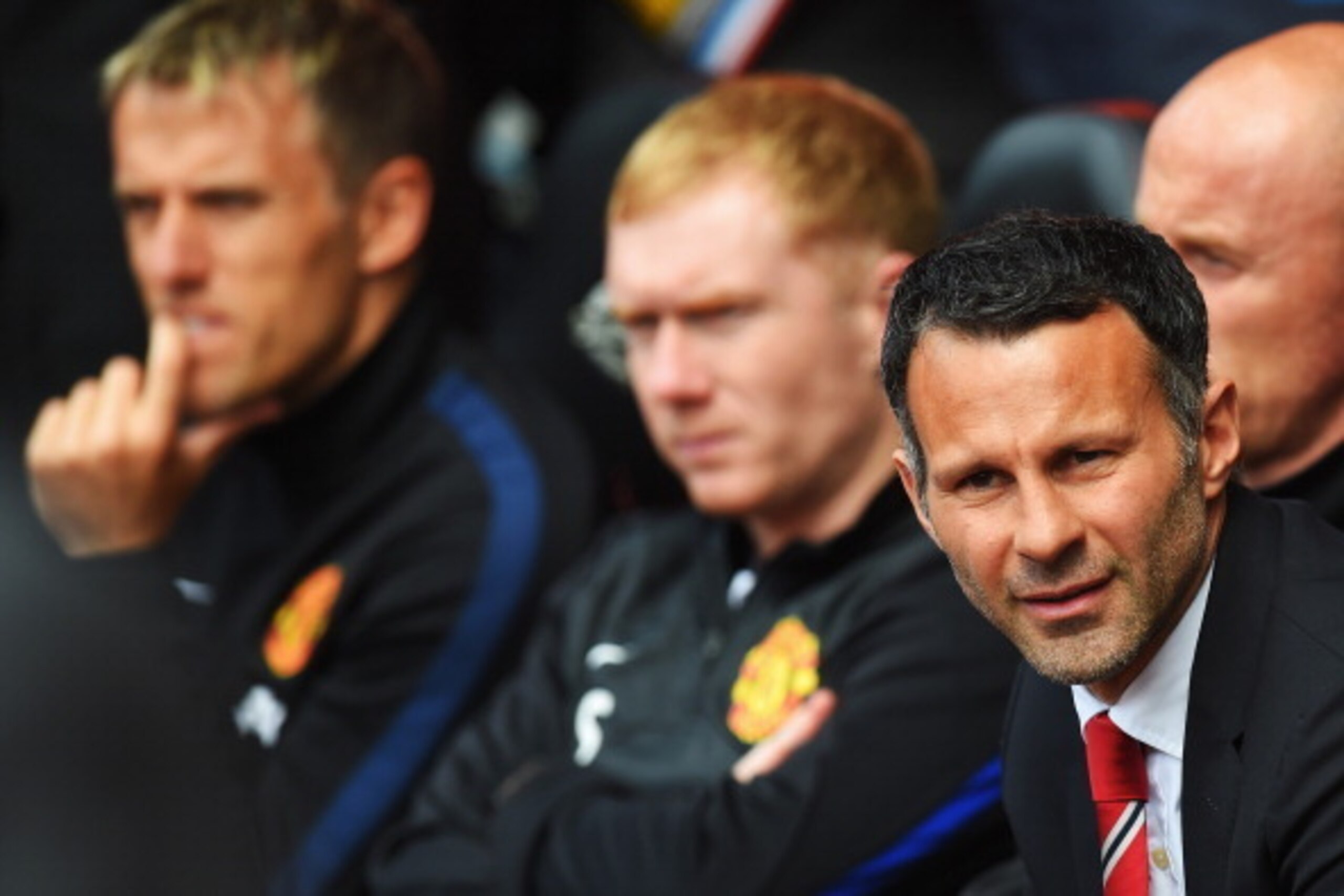 SOUTHAMPTON, ENGLAND - MAY 11: Manchester United interim manager Ryan Giggs (R) looks on alongside assistants Paul Scholes (C) and Phil Neville (L) before the Barclays Premier League match between Southampton and Manchester United at St Mary's Stadium on SOUTHAMPTON, ENGLAND - MAY 11: Manchester United interim manager Ryan Giggs (R) looks on alongside assistants Paul Scholes (C) and Phil Neville (L) before the Barclays Premier League match between Southampton and Manchester United at St Mary's Stadium on