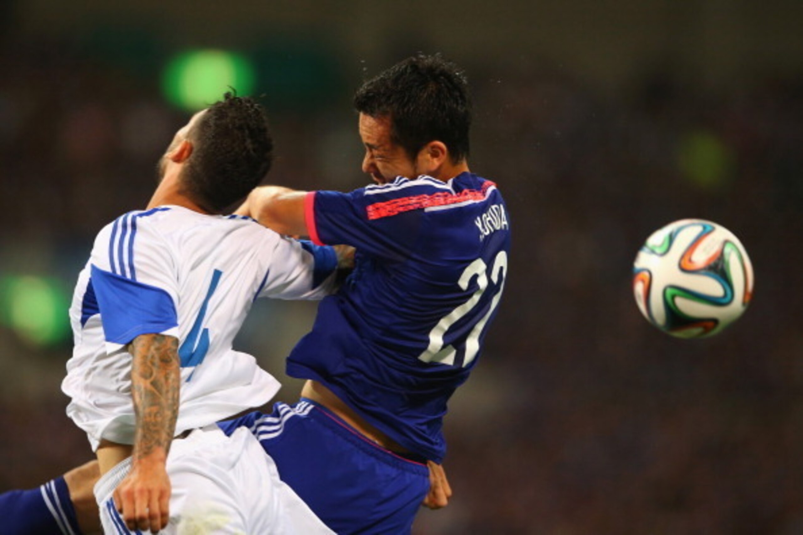 SAITAMA, JAPAN - MAY 27: (EDITORIAL USE ONLY) Giorgios Merkis of Cyprus and Maya Yoshida of Japan compete for the ball in the air during the Kirin Challenge Cup international friendly match between Japan and Cyprus at Saitama Stadium on May 27, 2014 in SAITAMA, JAPAN - MAY 27: (EDITORIAL USE ONLY) Giorgios Merkis of Cyprus and Maya Yoshida of Japan compete for the ball in the air during the Kirin Challenge Cup international friendly match between Japan and Cyprus at Saitama Stadium on May 27, 2014 in