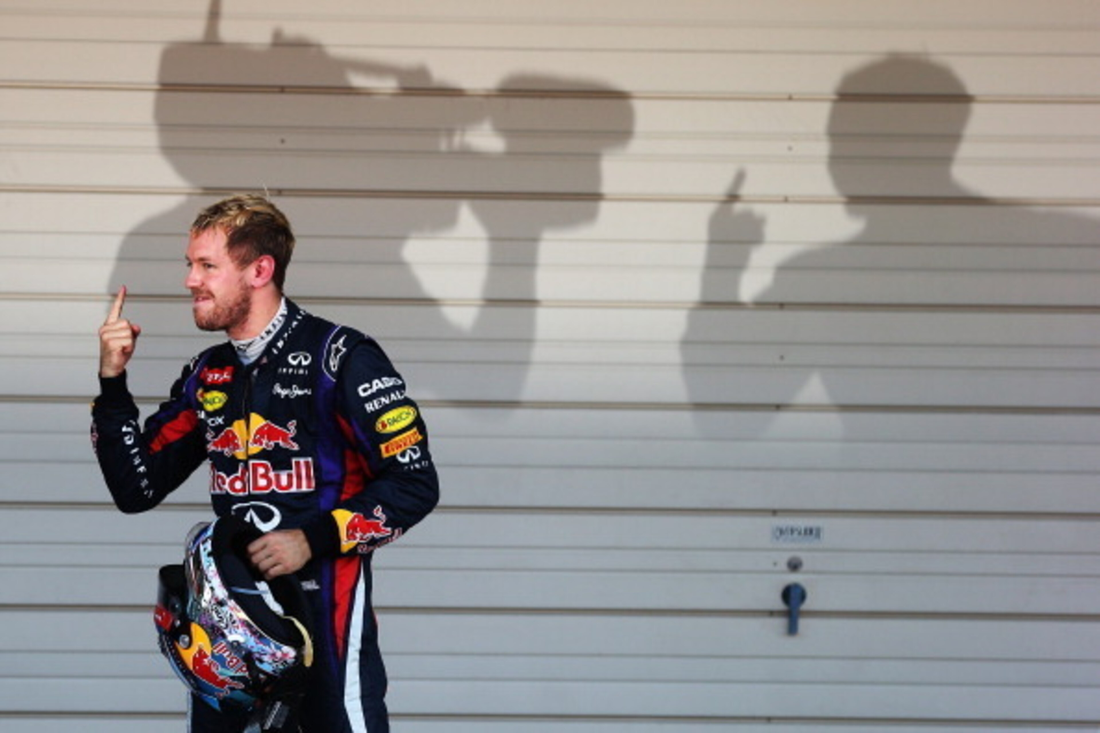 SUZUKA, JAPAN - OCTOBER 13:  Sebastian Vettel of Germany and Infiniti Red Bull Racing celebrates in parc ferme after winning the Japanese Formula One Grand Prix at Suzuka Circuit on October 13, 2013 in Suzuka, Japan.  (Photo by Mark Thompson/Getty Images)