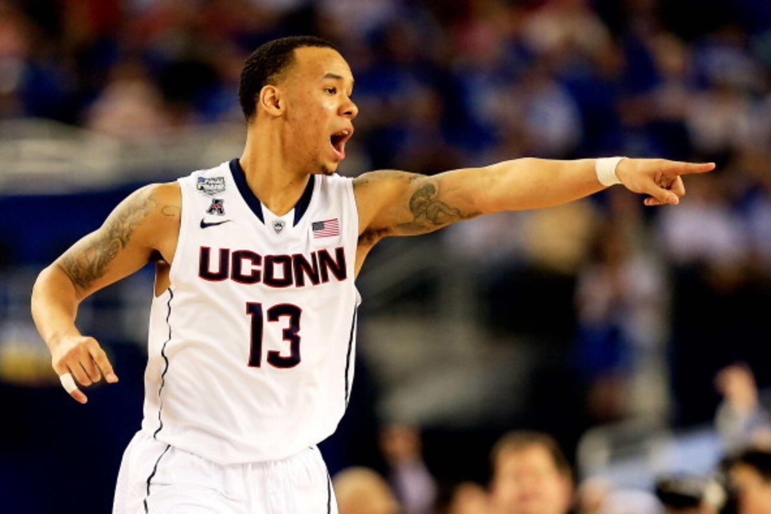 ARLINGTON, TX - APRIL 07: Shabazz Napier #13 of the Connecticut Huskies calls a play against the Kentucky Wildcats during the NCAA Men's Final Four Championship at AT&T Stadium on April 7, 2014 in Arlington, Texas.  (Photo by Jamie Squire/Getty Images)