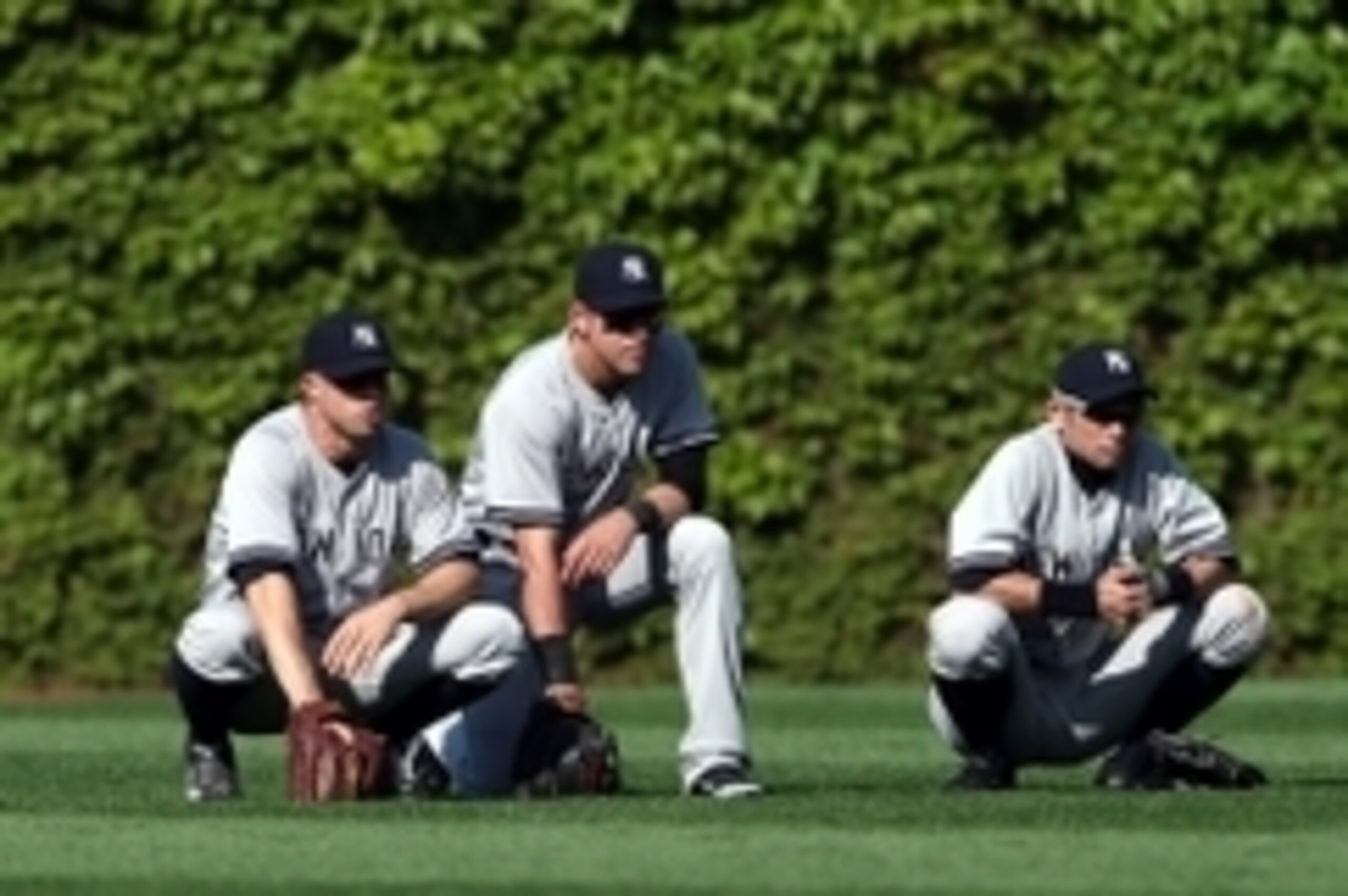 May 21, 2014; Chicago, IL, USA; New York Yankees outfielders from left Brett Gardner , Jacoby Ellsbury and Ichiro Suzuki wait during a pitching change during the game against the Chicago Cubs at Wrigley Field. Mandatory Credit: Jerry Lai-USA TODAY Sports