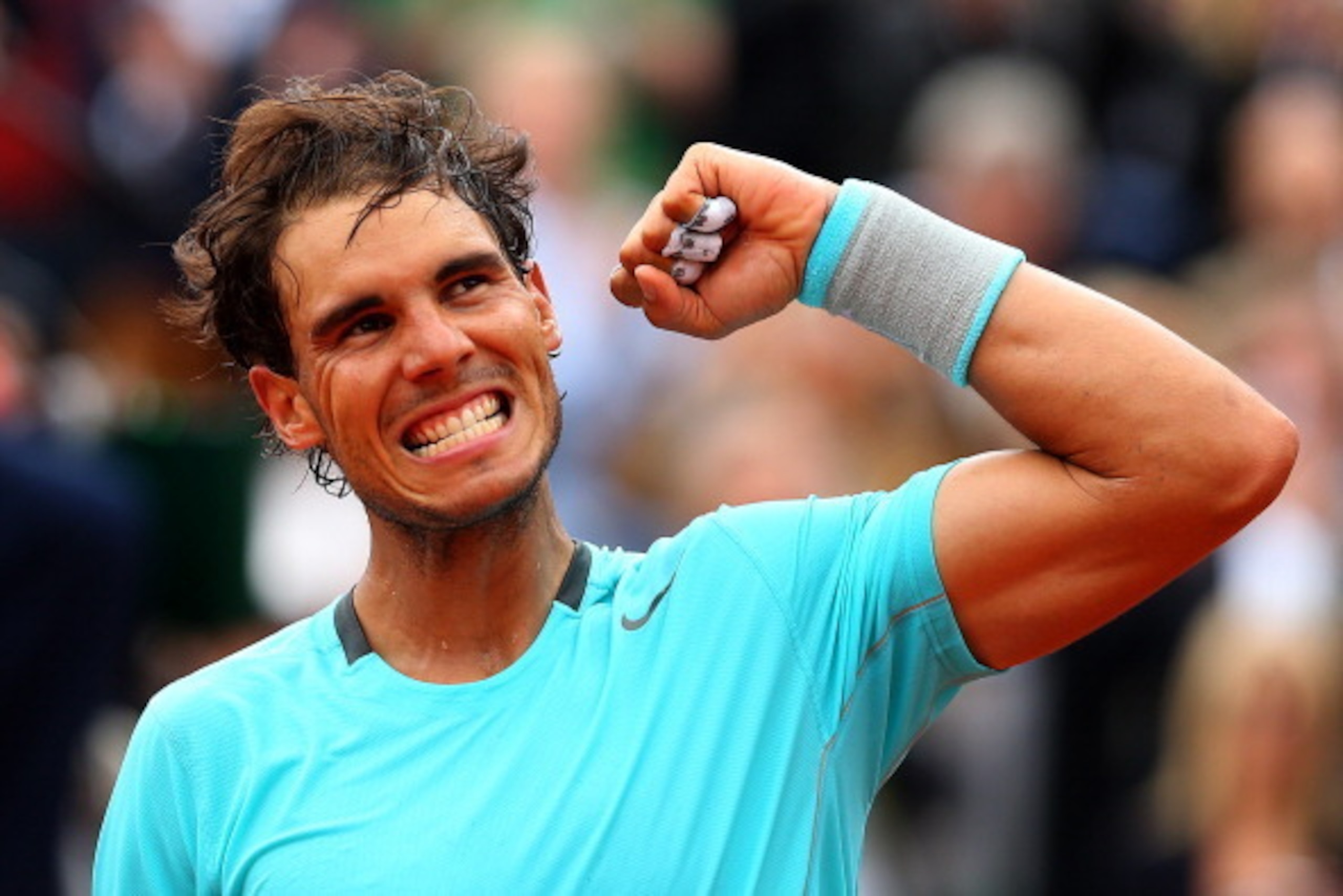 PARIS, FRANCE - MAY 29:  Rafael Nadal of Spain celebrates victory in his men's singles match against dominic thiem of Austria on day five of the French Open at Roland Garros on May 29, 2014 in Paris, France.  (Photo by Clive Brunskill/Getty Images)