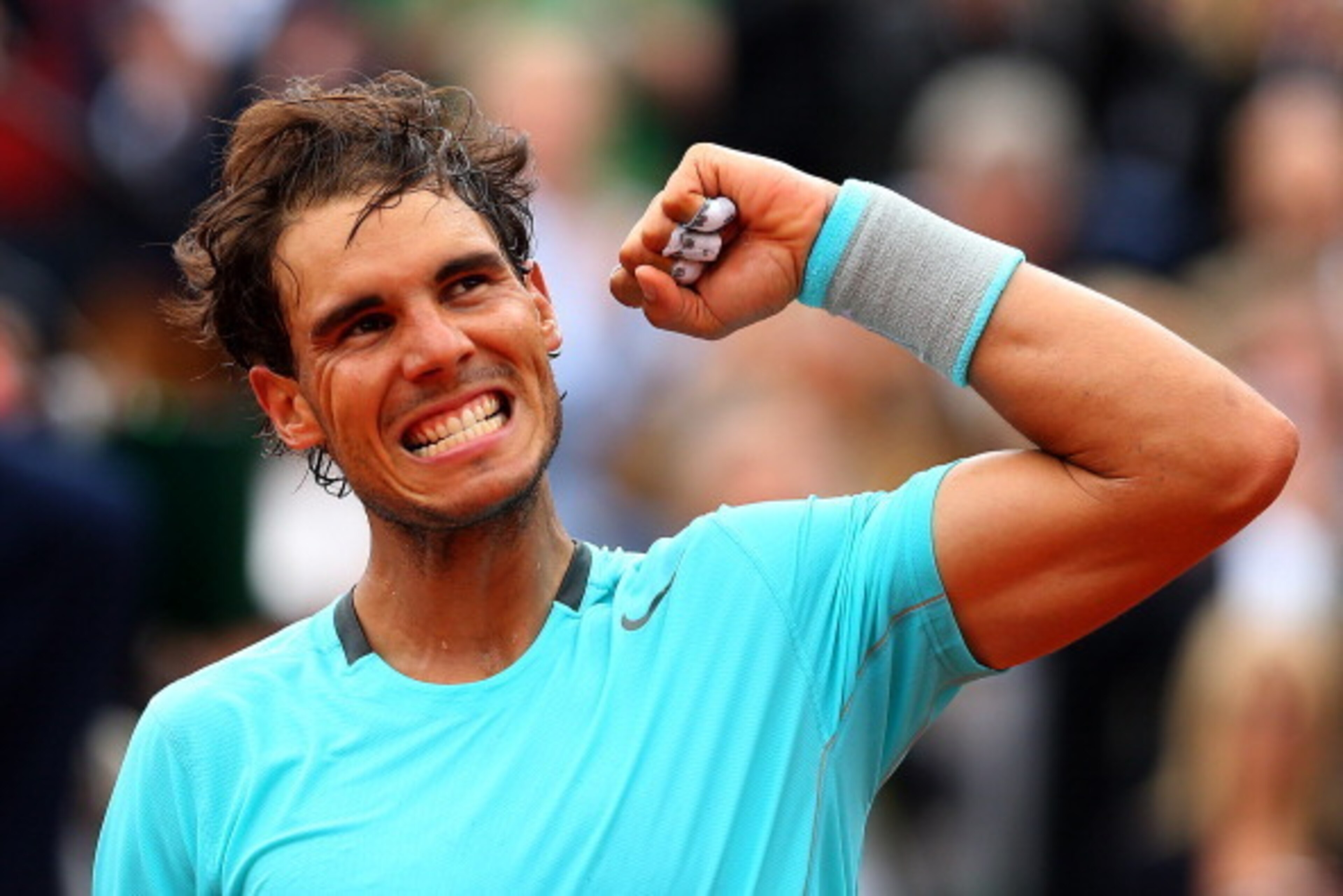 PARIS, FRANCE - MAY 29:  Rafael Nadal of Spain celebrates victory in his men's singles match against dominic thiem of Austria on day five of the French Open at Roland Garros on May 29, 2014 in Paris, France.  (Photo by Clive Brunskill/Getty Images)
