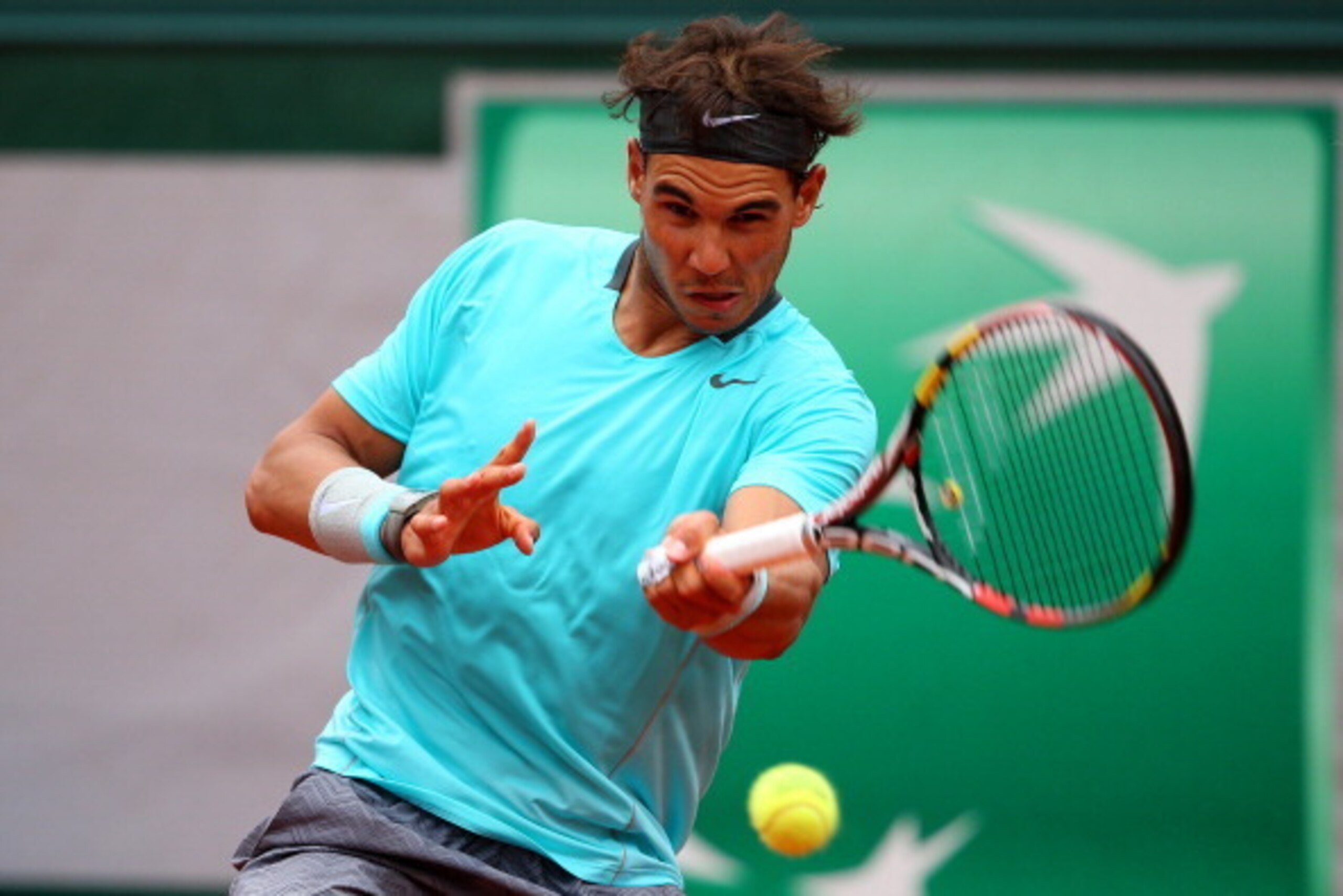 PARIS, FRANCE - MAY 29: Rafael Nadal of Spain returns a shot during his men's singles match against dominic thiem of Austria on day five of the French Open at Roland Garros on May 29, 2014 in Paris, France. (Photo by Clive Brunskill/Getty Images) PARIS, FRANCE - MAY 29: Rafael Nadal of Spain returns a shot during his men's singles match against dominic thiem of Austria on day five of the French Open at Roland Garros on May 29, 2014 in Paris, France. (Photo by Clive Brunskill/Getty Images)