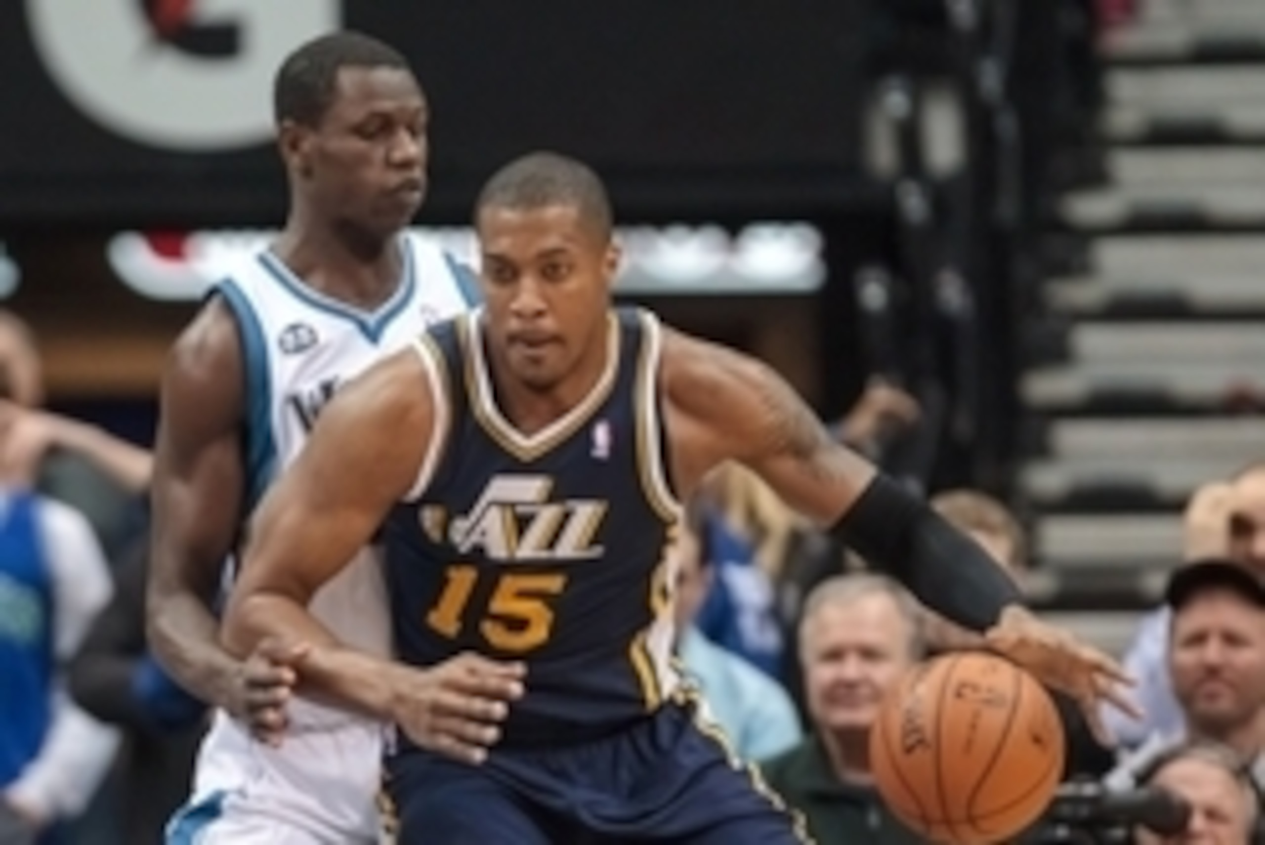 Apr 16, 2014; Minneapolis, MN, USA; Utah Jazz center Derrick Favors (15) dribbles in the first quarter against the Minnesota Timberwolves center Gorgui Dieng (5) at Target Center. Mandatory Credit: Brad Rempel-USA TODAY Sports