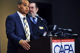 CHICAGO IL - JANUARY 28:  Leo W. Gerard, President of the Steelworkers, (R) and Northwestern quarterback Kain Colter answer questions at a press conference on January 28 2014 at  The Hyatt Regency Hotel in Chicago Illinois. Citing what they deem as the NC