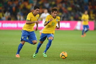 JOHANNESBURG, SOUTH AFRICA - MARCH 05: Paulinho and  Neymar of Brazil in action during the International Friendly match between South Africa and Brazil at FNB Stadium on March 05, 2014 in Johannesburg, South Africa. (Photo by Lefty Shivambu/Gallo Images/G