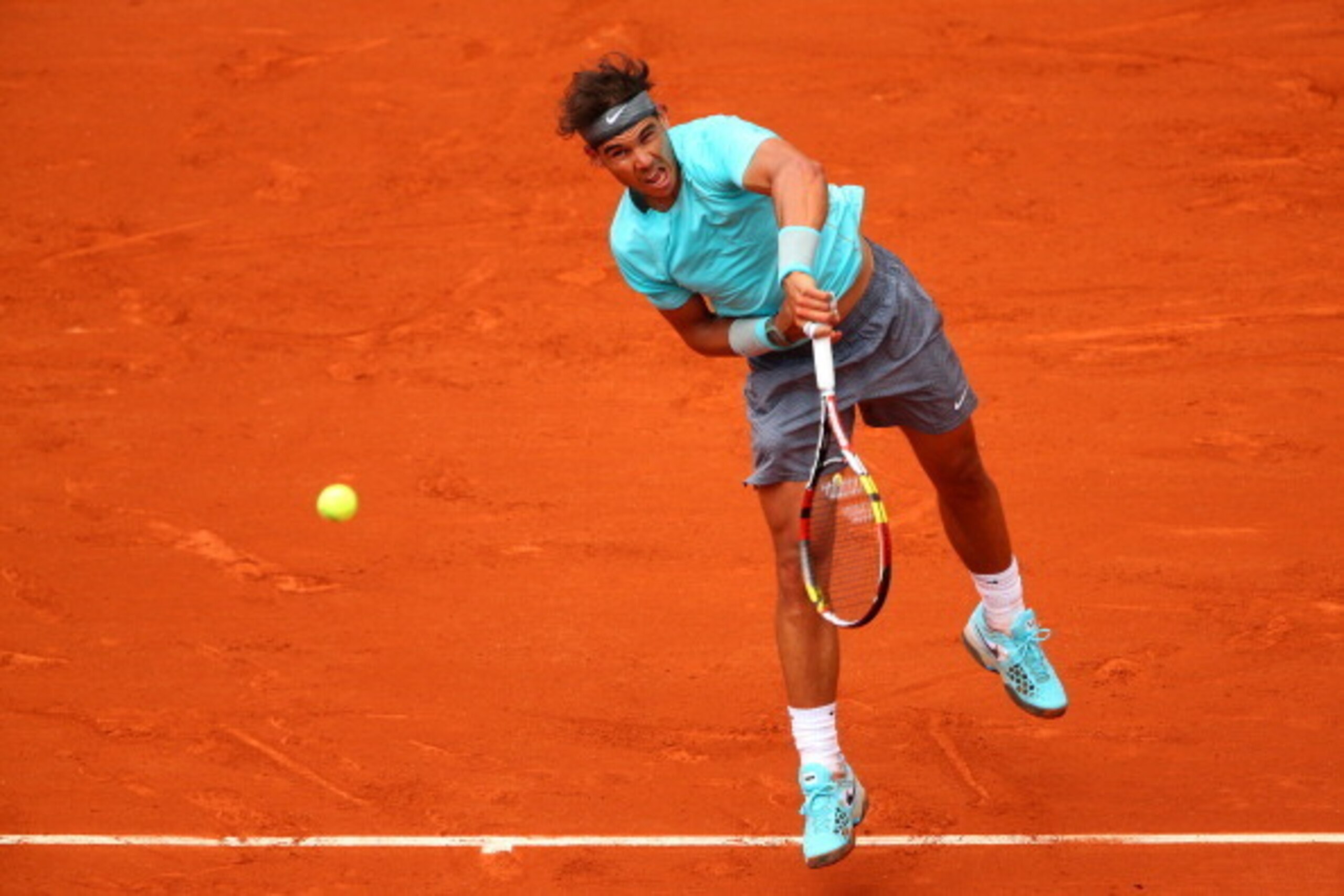 PARIS, FRANCE - MAY 29: Rafael Nadal of Spain serves during his men's singles match against dominic thiem of Austria on day five of the French Open at Roland Garros on May 29, 2014 in Paris, France. (Photo by Clive Brunskill/Getty Images) PARIS, FRANCE - MAY 29: Rafael Nadal of Spain serves during his men's singles match against dominic thiem of Austria on day five of the French Open at Roland Garros on May 29, 2014 in Paris, France. (Photo by Clive Brunskill/Getty Images)