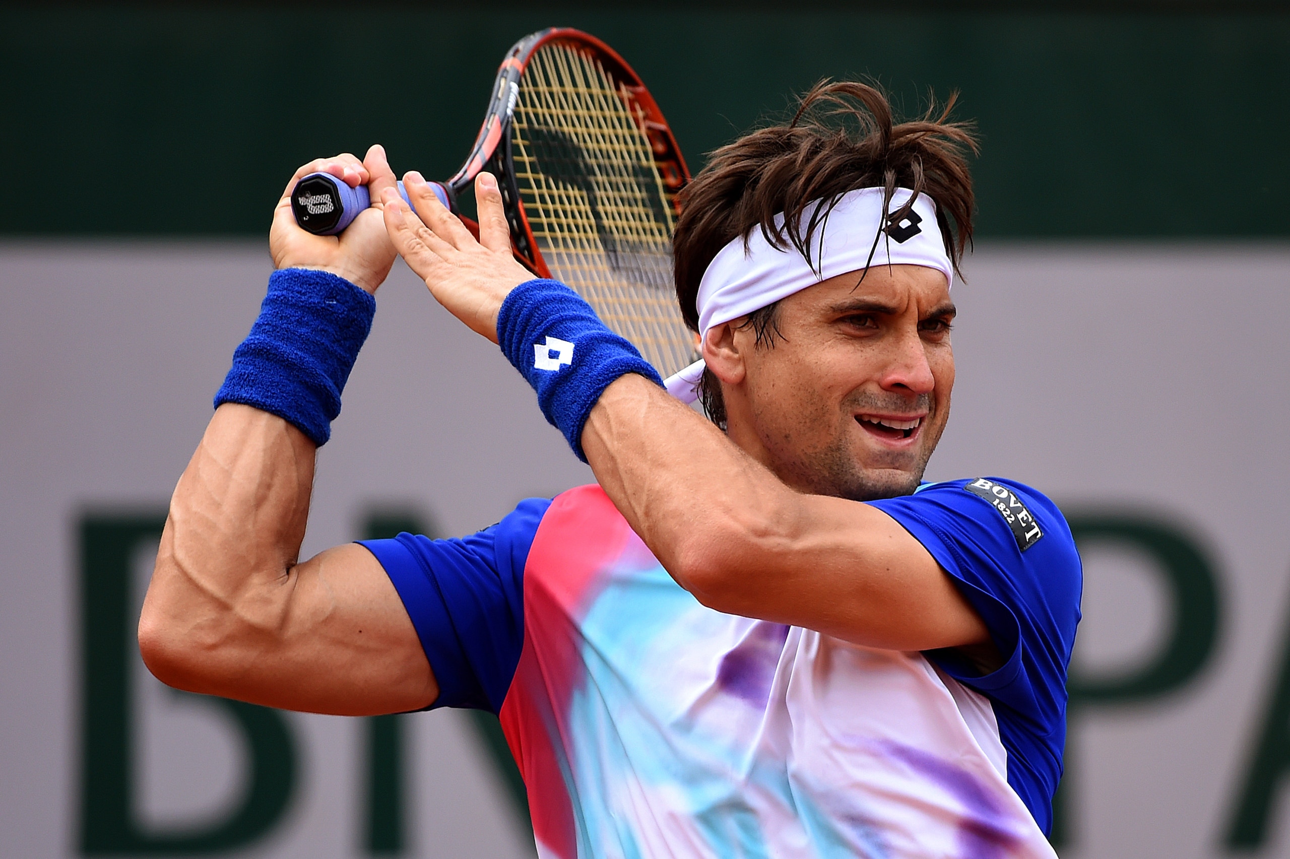 PARIS, FRANCE - MAY 29: David Ferrer of Spain returns a shot during his men's singles match against Simone Bolelli of Italy on day five of the French Open at Roland Garros on May 29, 2014 in Paris, France. (Photo by Matthias Hangst/Getty Images) PARIS, FRANCE - MAY 29: David Ferrer of Spain returns a shot during his men's singles match against Simone Bolelli of Italy on day five of the French Open at Roland Garros on May 29, 2014 in Paris, France. (Photo by Matthias Hangst/Getty Images)