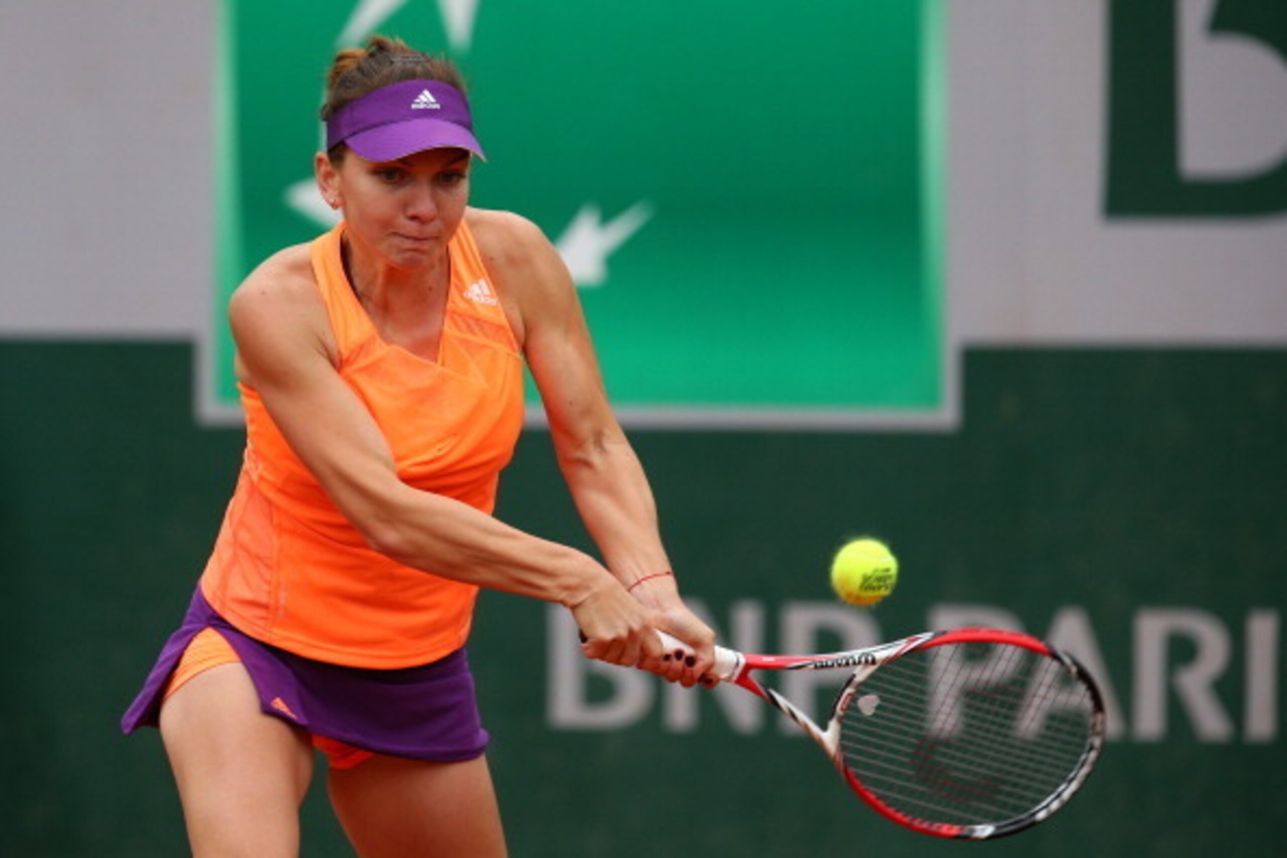 PARIS, FRANCE - MAY 29: Simona Halep of Romania returns a shot during her women's singles match against Heather Watson of Great Britain on day five of the French Open at Roland Garros on May 29, 2014 in Paris, France. (Photo by Clive Brunskill/Getty Ima PARIS, FRANCE - MAY 29: Simona Halep of Romania returns a shot during her women's singles match against Heather Watson of Great Britain on day five of the French Open at Roland Garros on May 29, 2014 in Paris, France. (Photo by Clive Brunskill/Getty Ima