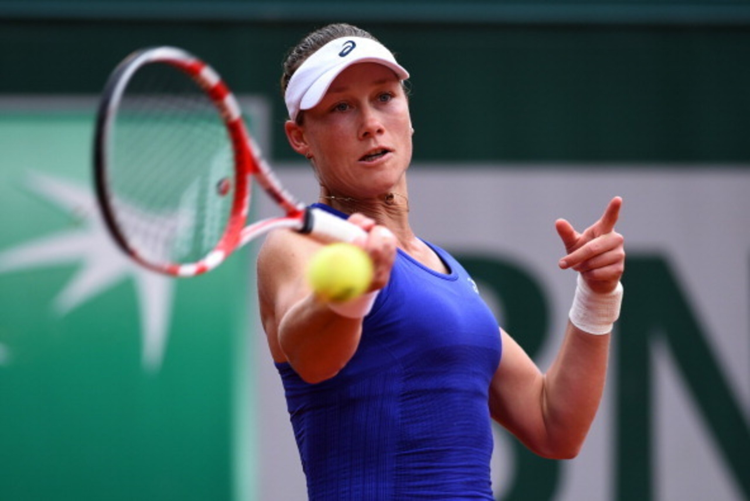 PARIS, FRANCE - MAY 28:  Samantha Stosur of Australia returns a shot during her women's singles match against Yvonne Meusburger of Austria on day four of the French Open at Roland Garros on May 28, 2014 in Paris, France.  (Photo by Matthias Hangst/Getty I