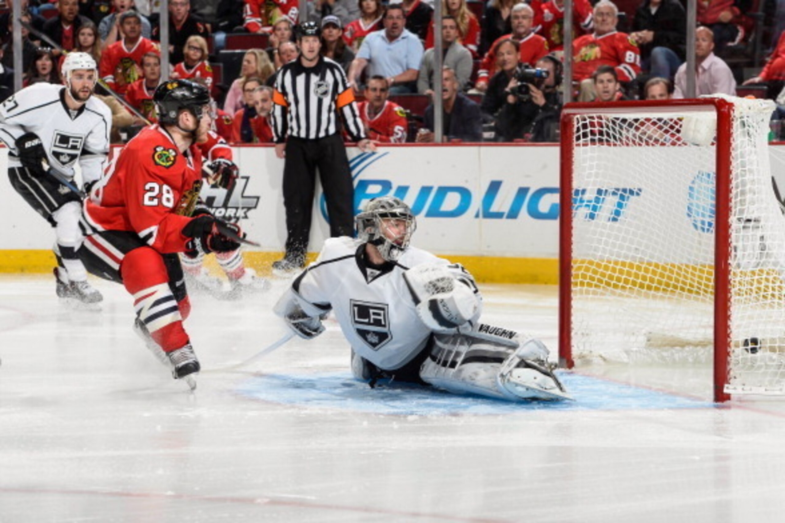 CHICAGO, IL - MAY 28: Ben Smith #28 of the Chicago Blackhawks scores on goalie Jonathan Quick #32 of the Los Angeles Kings in the third period in Game Five of the Western Conference Final during the 2014 NHL Stanley Cup Playoffs at the United Center on Ma