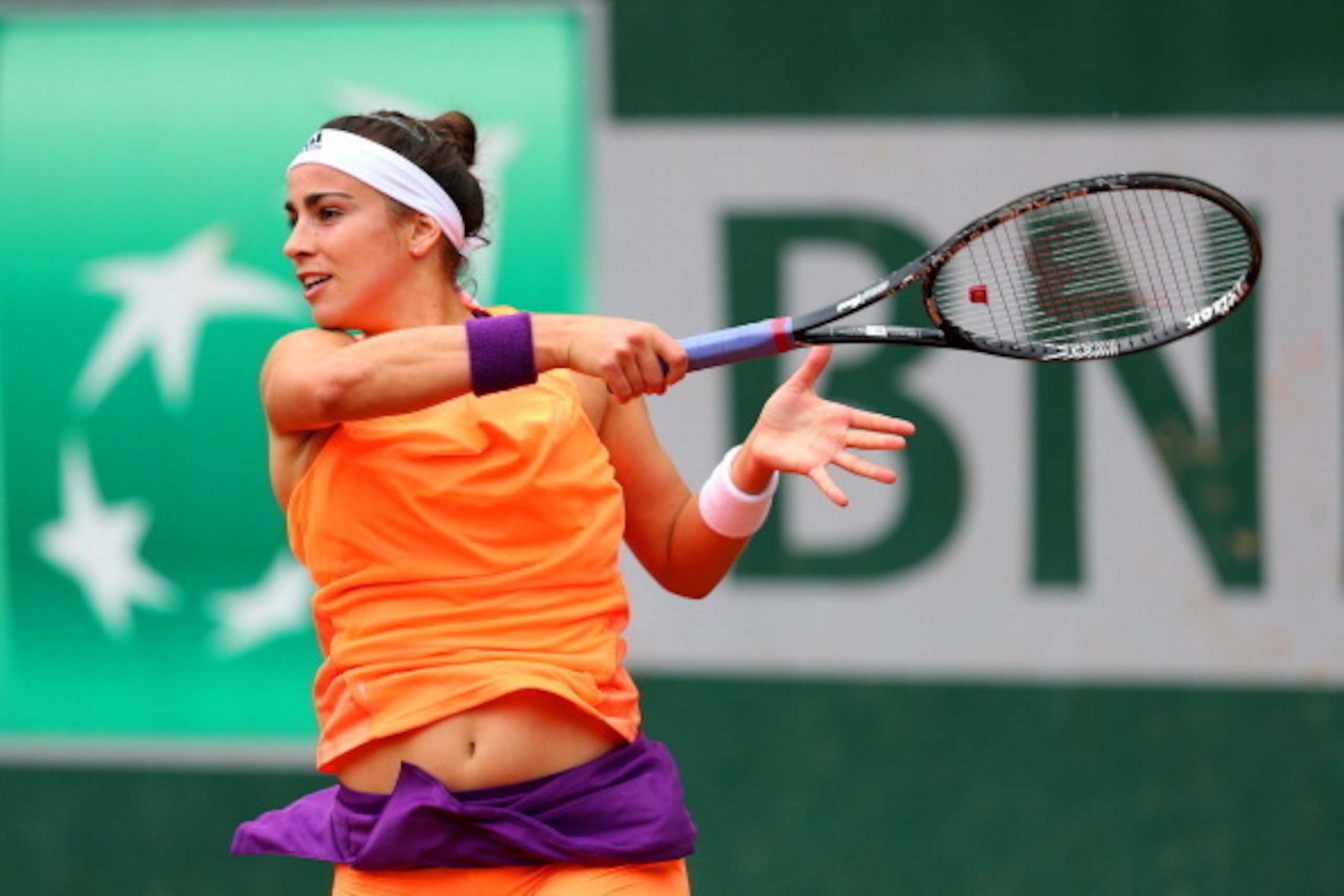 PARIS, FRANCE - MAY 26:  Paula Ormaechea of Argentina returns a shot in her women's singles match against Romina Oprandi of Switzerland on day two of the French Open at Roland Garros on May 26, 2014 in Paris, France.  (Photo by Clive Brunskill/Getty Image