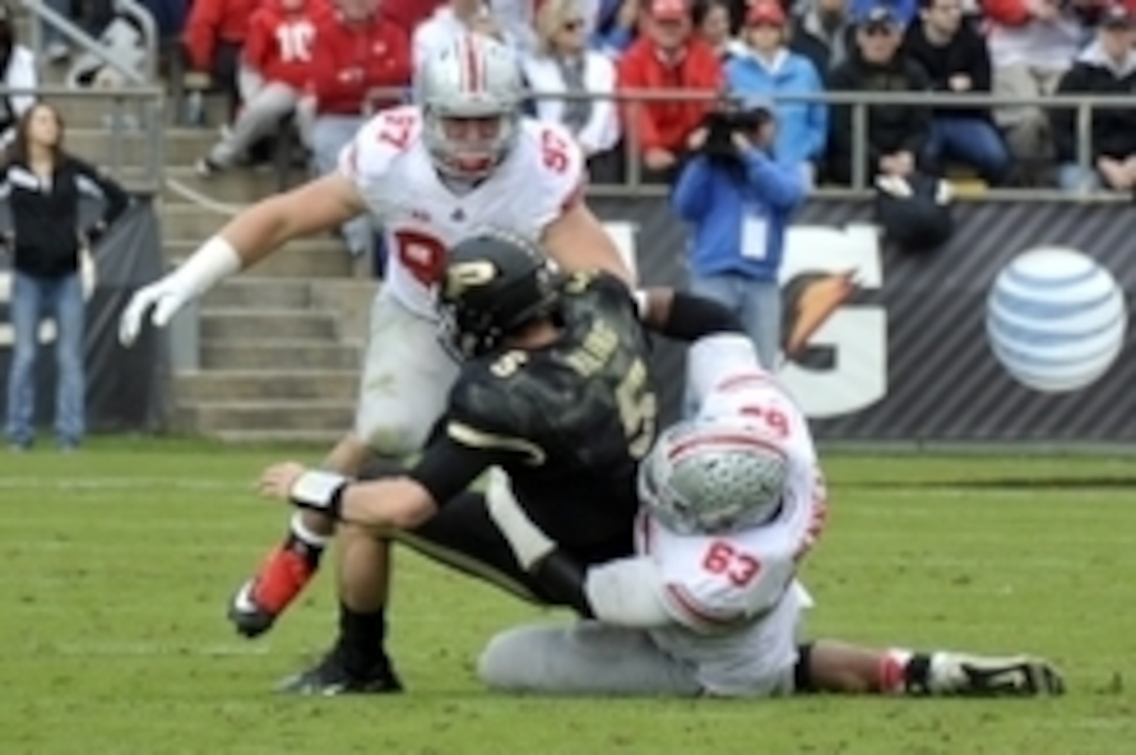 Nov 2, 2013; West Lafayette, IN, USA; Purdue Boilermakers quarterback Danny Etling (5) is sacked by Ohio State Buckeyes defensive lineman Michael Bennett (63) and defensive lineman Joey Bosa (97) in the first half at Ross Ade Stadium. Mandatory Credit: S Nov 2, 2013; West Lafayette, IN, USA; Purdue Boilermakers quarterback Danny Etling (5) is sacked by Ohio State Buckeyes defensive lineman Michael Bennett (63) and defensive lineman Joey Bosa (97) in the first half at Ross Ade Stadium. Mandatory Credit: S