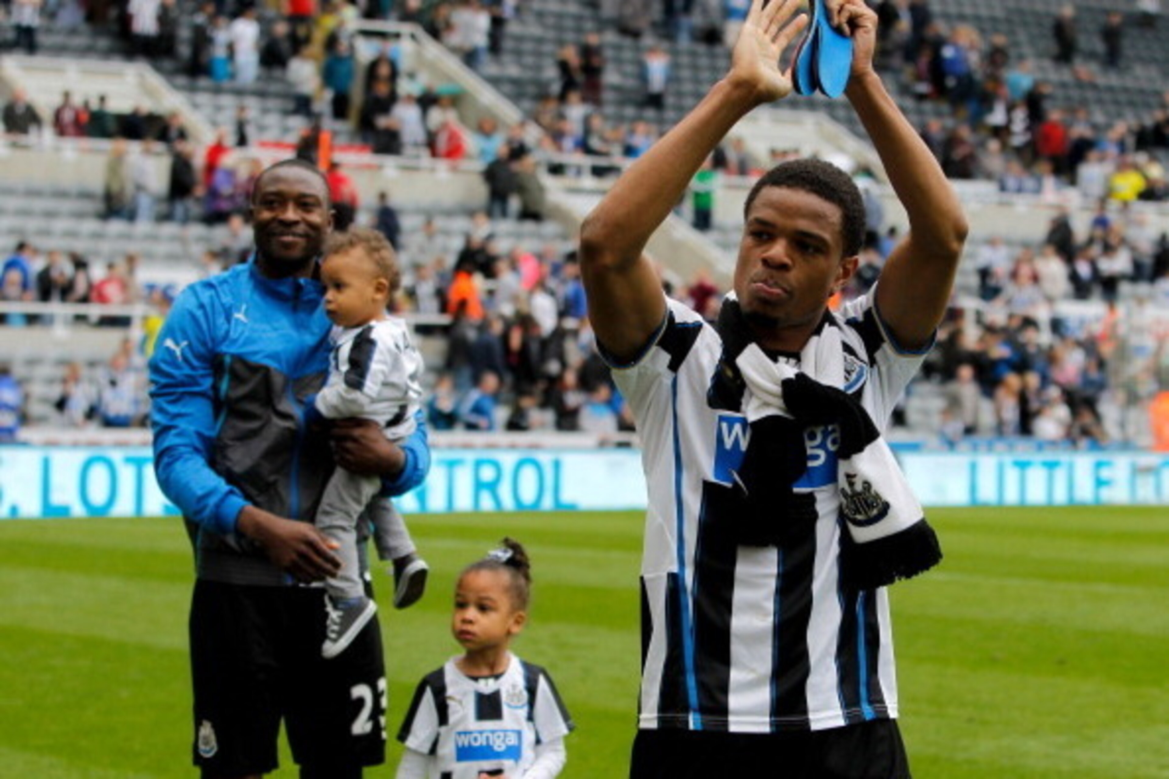 NEWCASTLE, ENGLAND-  May 03: Loic Remy (R) and Shola Ameobi (L) of Newcastle during a lap of honour after the Barclays Premier League match between Newcastle United and Cardiff City at St. James'  Park on May 03, 2014  in Newcastle upon Tyne, England. (Ph