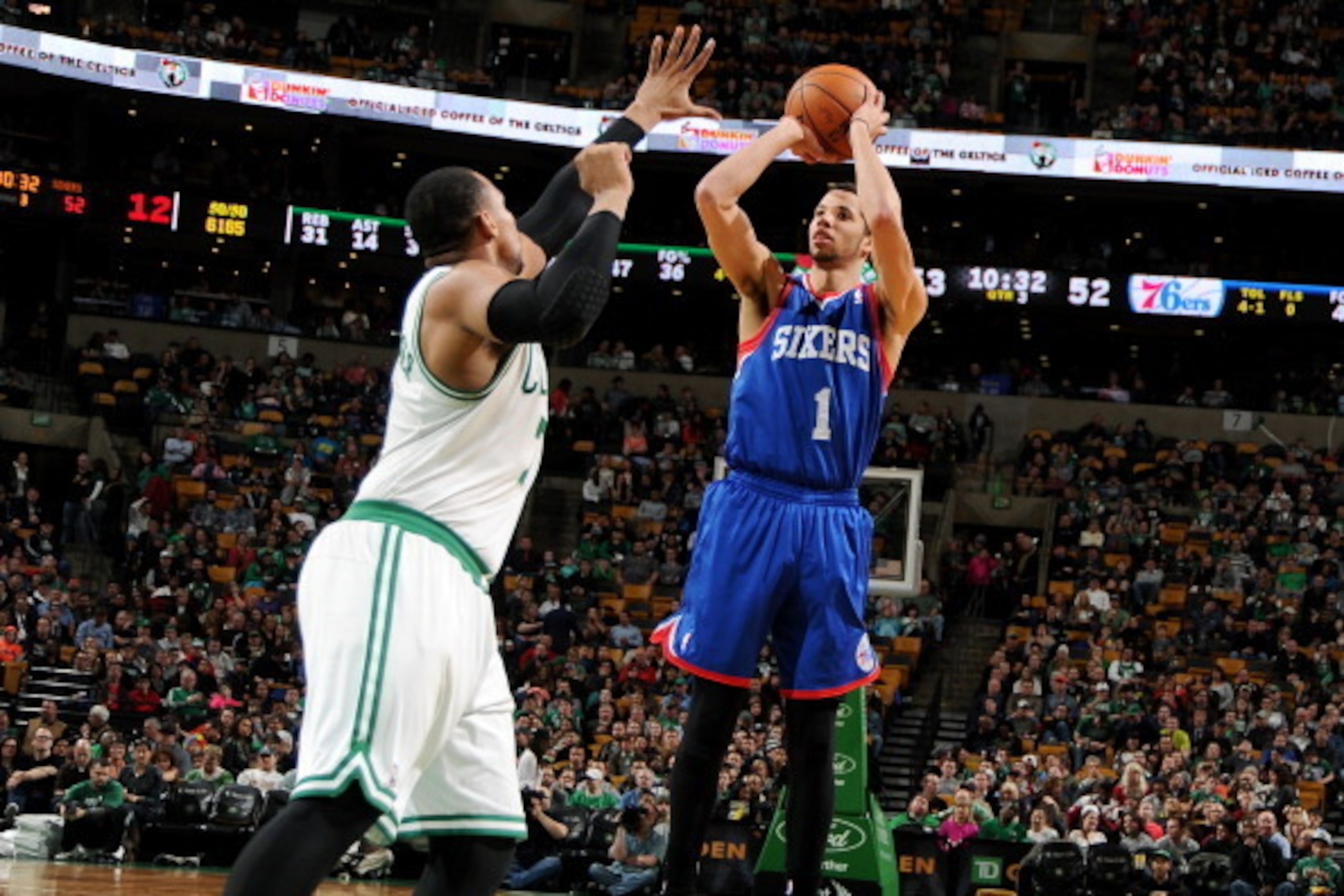 BOSTON, MA - APRIL 4: Michael Carter-Williams #1 of the Philadelphia 76ers shoots against Jared Sullinger #7 of the Boston Celtics on April 4, 2014 at the TD Garden in Boston, Massachusetts.  NOTE TO USER: User expressly acknowledges and agrees that, by d