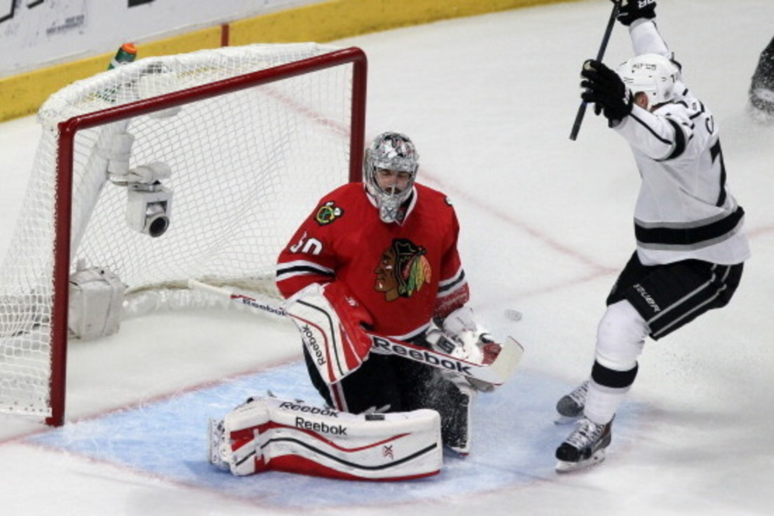 CHICAGO, IL - MAY 28: Corey Crawford #50 of the Chicago Blackhawks gives up a goal to Tanner Pearson #70 of the Los Angeles Kings as teammate Jeff Carter #77 celebrates in the second period during Game Five of the Western Conference Final in the 2014 Sta CHICAGO, IL - MAY 28: Corey Crawford #50 of the Chicago Blackhawks gives up a goal to Tanner Pearson #70 of the Los Angeles Kings as teammate Jeff Carter #77 celebrates in the second period during Game Five of the Western Conference Final in the 2014 Sta