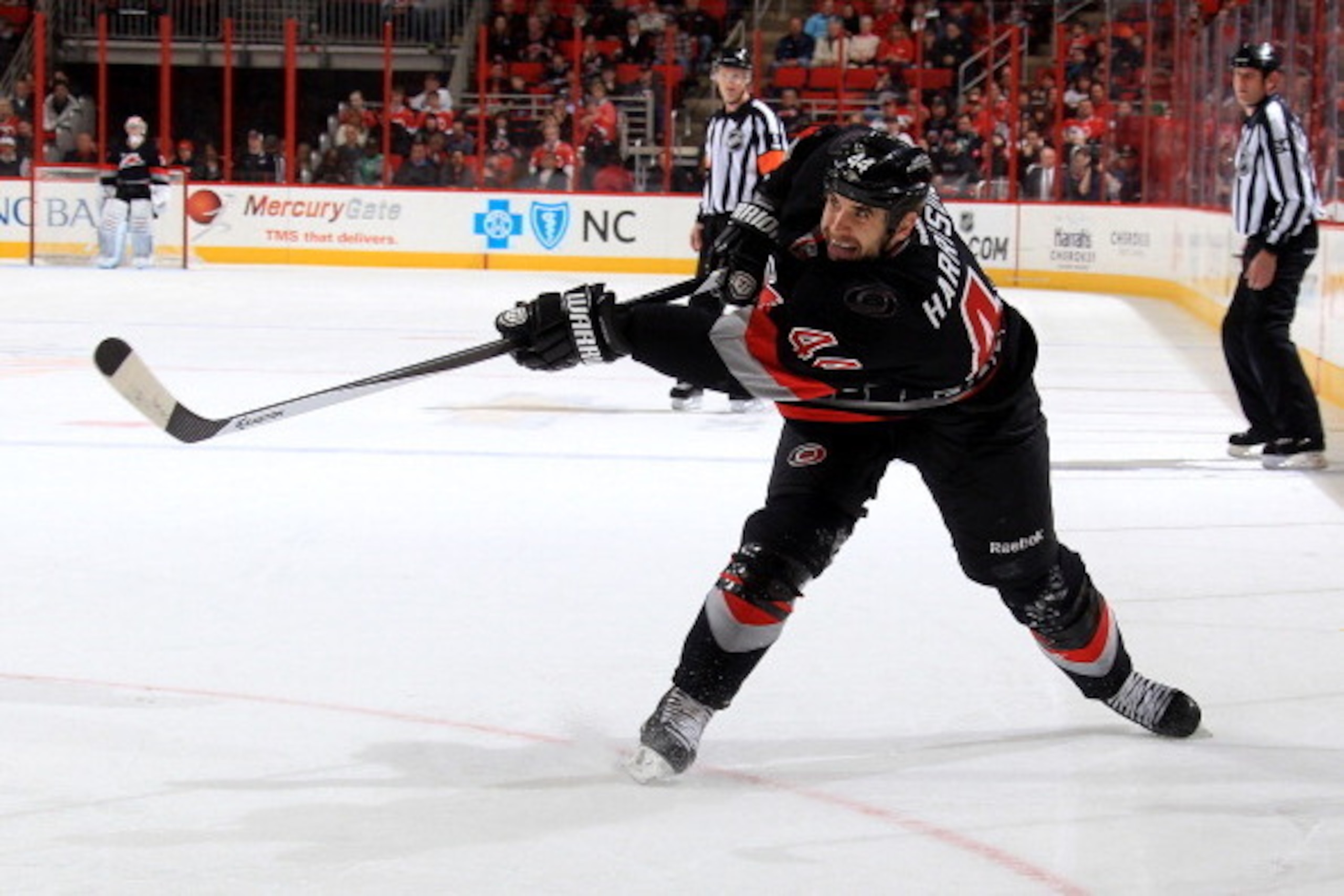 RALEIGH, NC - MARCH 16: Jay Harrison #44 of the Carolina Hurricanes shoots the puck during their NHL game against the Edmonton Oilers at PNC Arena on March 16, 2014 in Raleigh, North Carolina.  (Photo by Gregg Forwerck/NHLI via Getty Images)