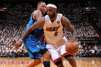 MIAMI, FL - JUNE 12:  LeBron James #6 of the Miami Heat drives to the basket against Shawn Marion #0 of the Dallas Mavericks during Game Six of the 2011 NBA Finals on June 12, 2011 at the American Airlines Arena in Miami, Florida. NOTE TO USER: User expre