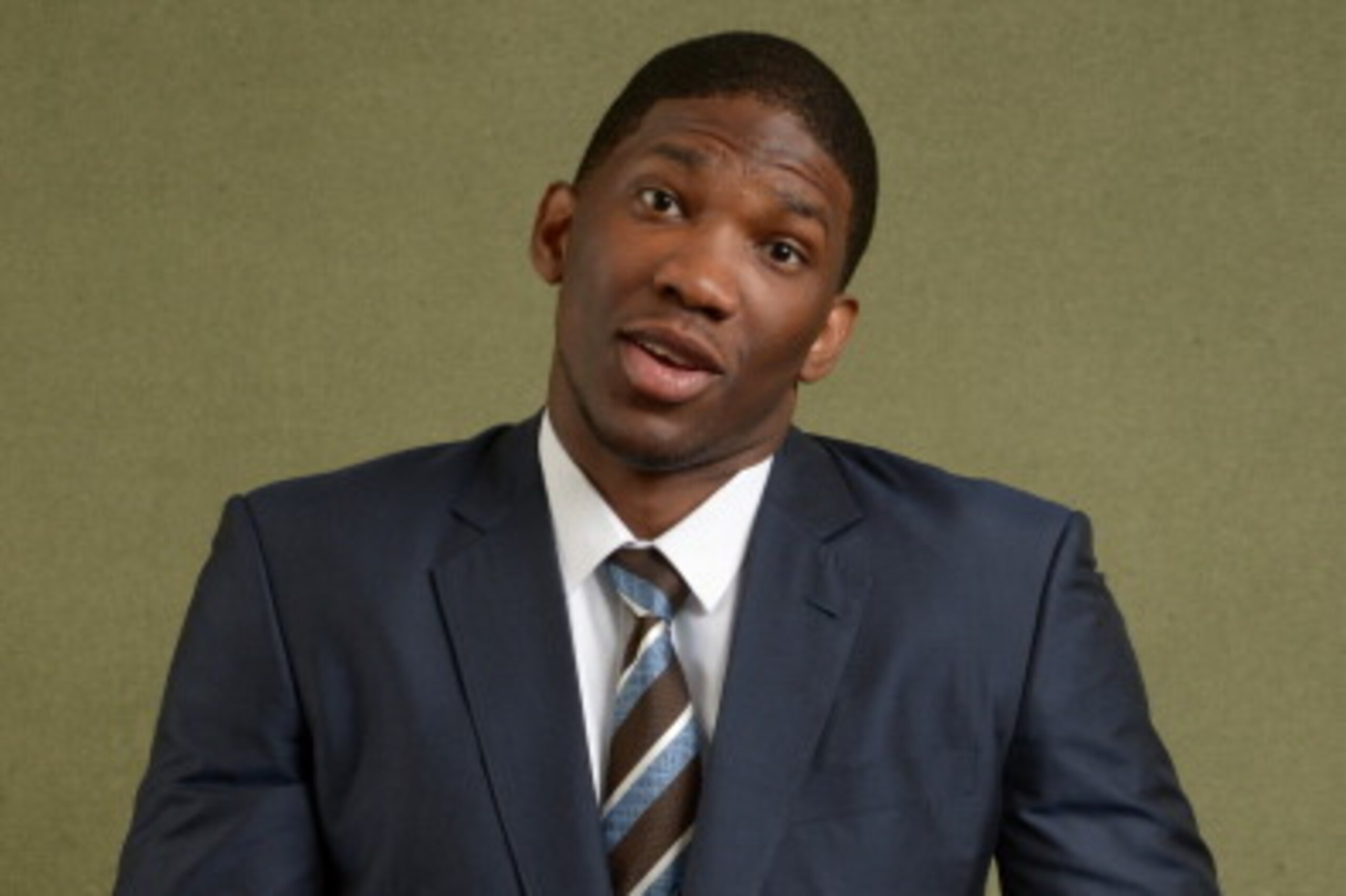 NEW YORK - MAY 20: NBA Draft prospect Joel Embiid poses for portraits with the Draft Caps prior to the 2013 NBA Draft Lottery on May 20, 2014 at the NBA Headquarters in New York City.  NOTE TO USER: User expressly acknowledges and agrees that, by download