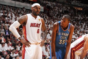 MIAMI, FL - JUNE 21:   LeBron James #6 of the Miami Heat and Kevin Durant #35 of the Oklahoma City Thunder look on during Game Five of the 2012 NBA Finals between the Miami Heat and the Oklahoma City Thunder at American Airlines Arena on June 21, 2012 in 