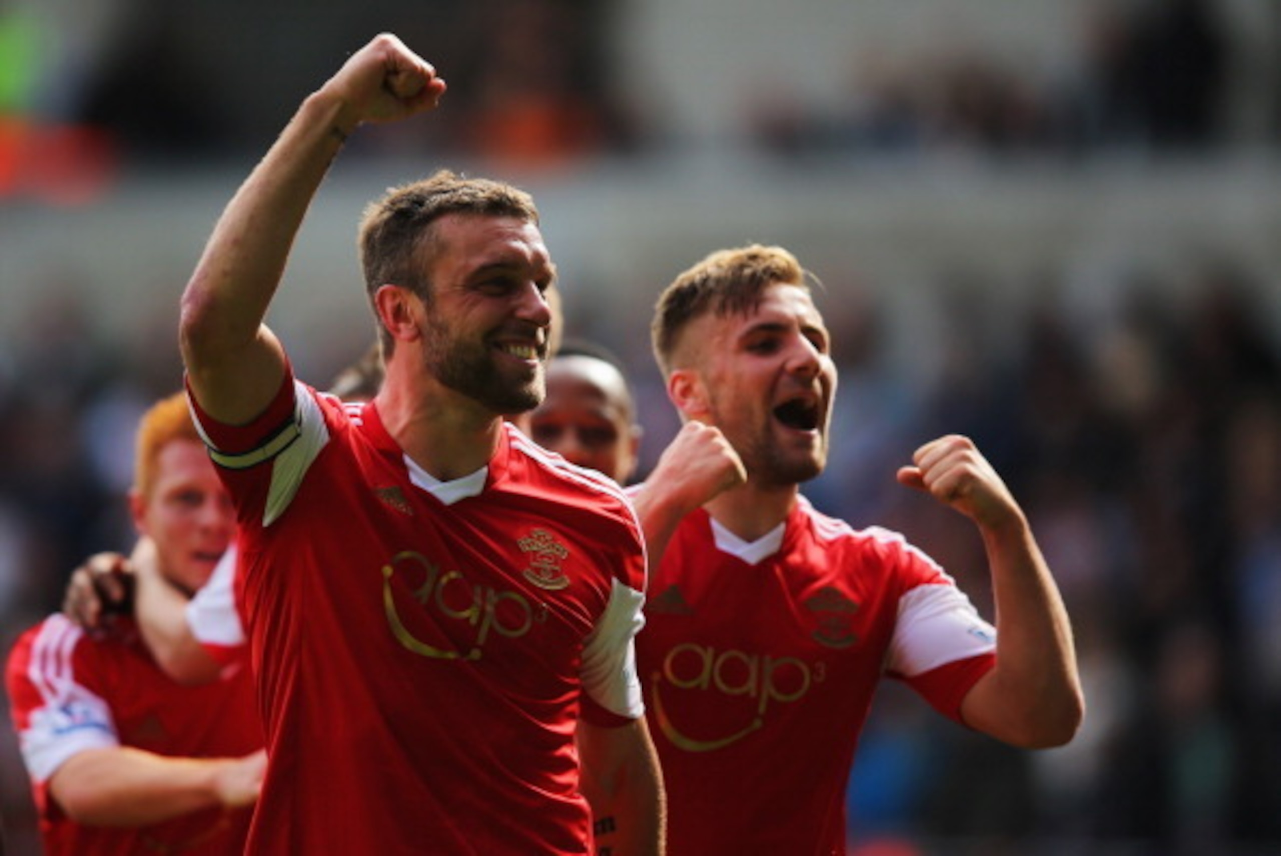 SWANSEA, WALES - MAY 03:  Rickie Lambert of Southampton celebrates with Luke Shaw (R) as he scores their first goal during the Barclays Premier League match between Swansea City and Southampton at Liberty Stadium on May 3, 2014 in Swansea, Wales.  (Photo