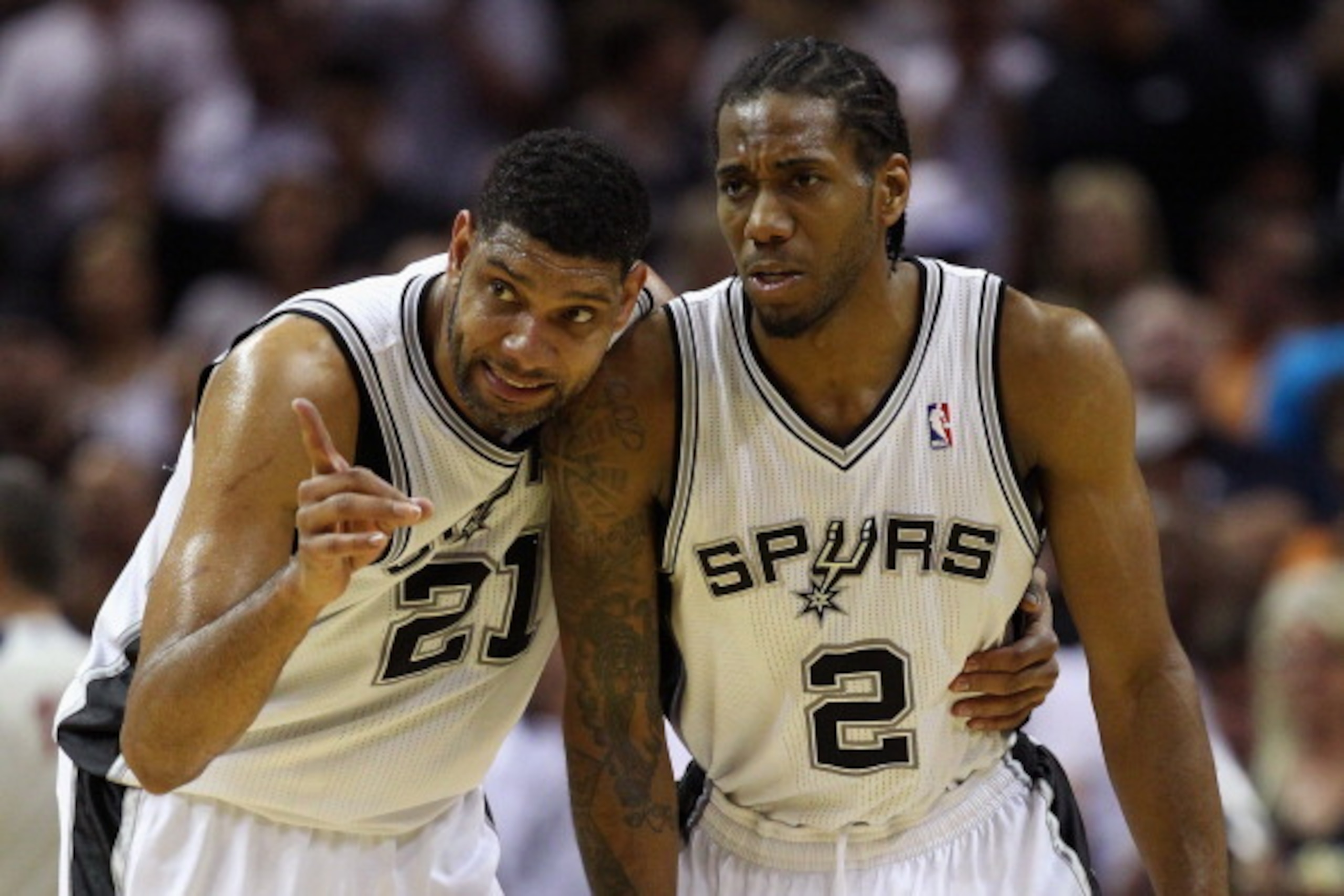 SAN ANTONIO, TX - MAY 29: Tim Duncan #21 and Kawhi Leonard #2 of the San Antonio Spurs talk in the second quarter against the Oklahoma City Thunder during Game Five of the Western Conference Finals of the 2014 NBA Playoffs at AT&T Center on May 29, 2014 i SAN ANTONIO, TX - MAY 29: Tim Duncan #21 and Kawhi Leonard #2 of the San Antonio Spurs talk in the second quarter against the Oklahoma City Thunder during Game Five of the Western Conference Finals of the 2014 NBA Playoffs at AT&T Center on May 29, 2014 i