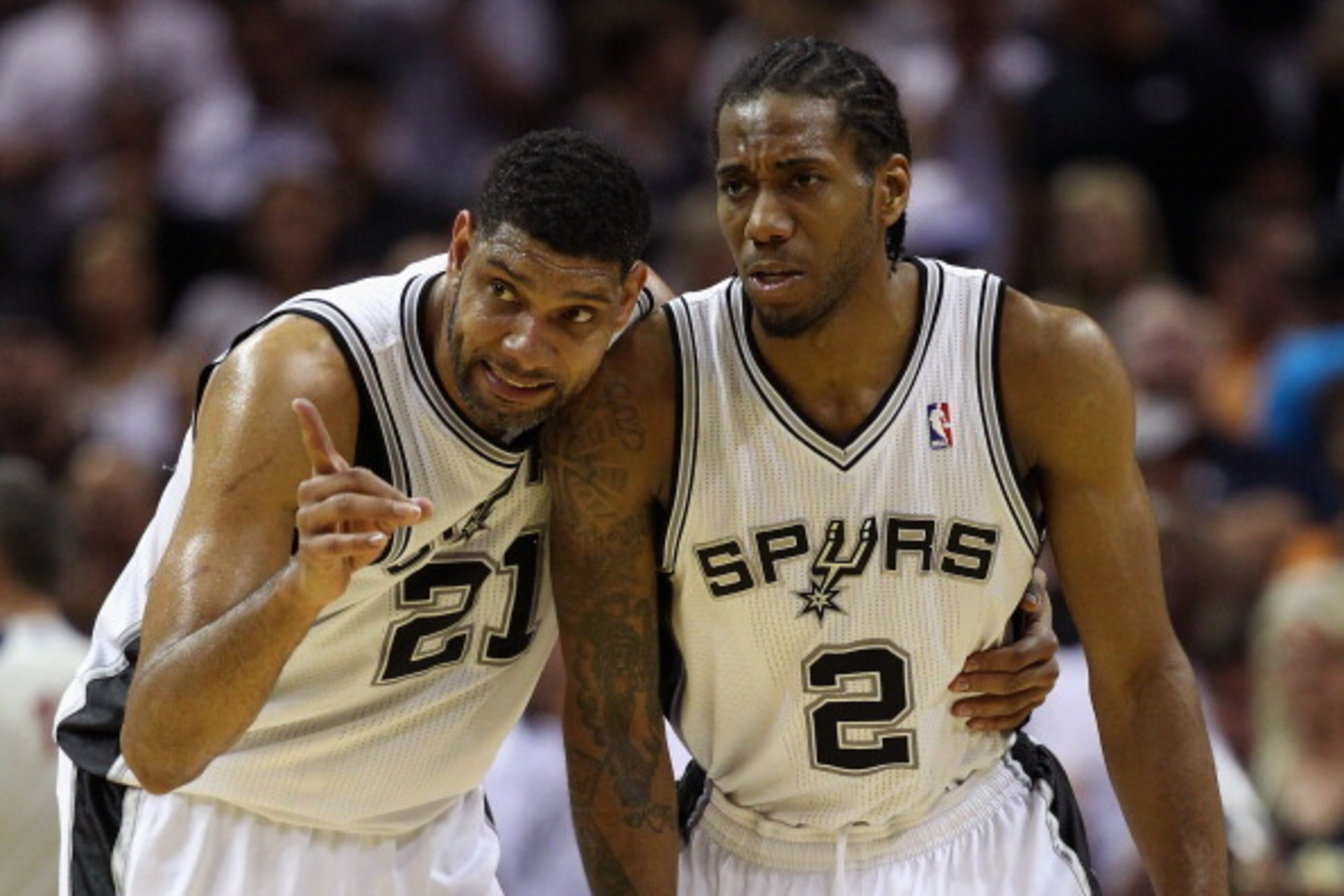 SAN ANTONIO, TX - MAY 29: Tim Duncan #21 and Kawhi Leonard #2 of the San Antonio Spurs talk in the second quarter against the Oklahoma City Thunder during Game Five of the Western Conference Finals of the 2014 NBA Playoffs at AT&T Center on May 29, 2014 i SAN ANTONIO, TX - MAY 29: Tim Duncan #21 and Kawhi Leonard #2 of the San Antonio Spurs talk in the second quarter against the Oklahoma City Thunder during Game Five of the Western Conference Finals of the 2014 NBA Playoffs at AT&T Center on May 29, 2014 i