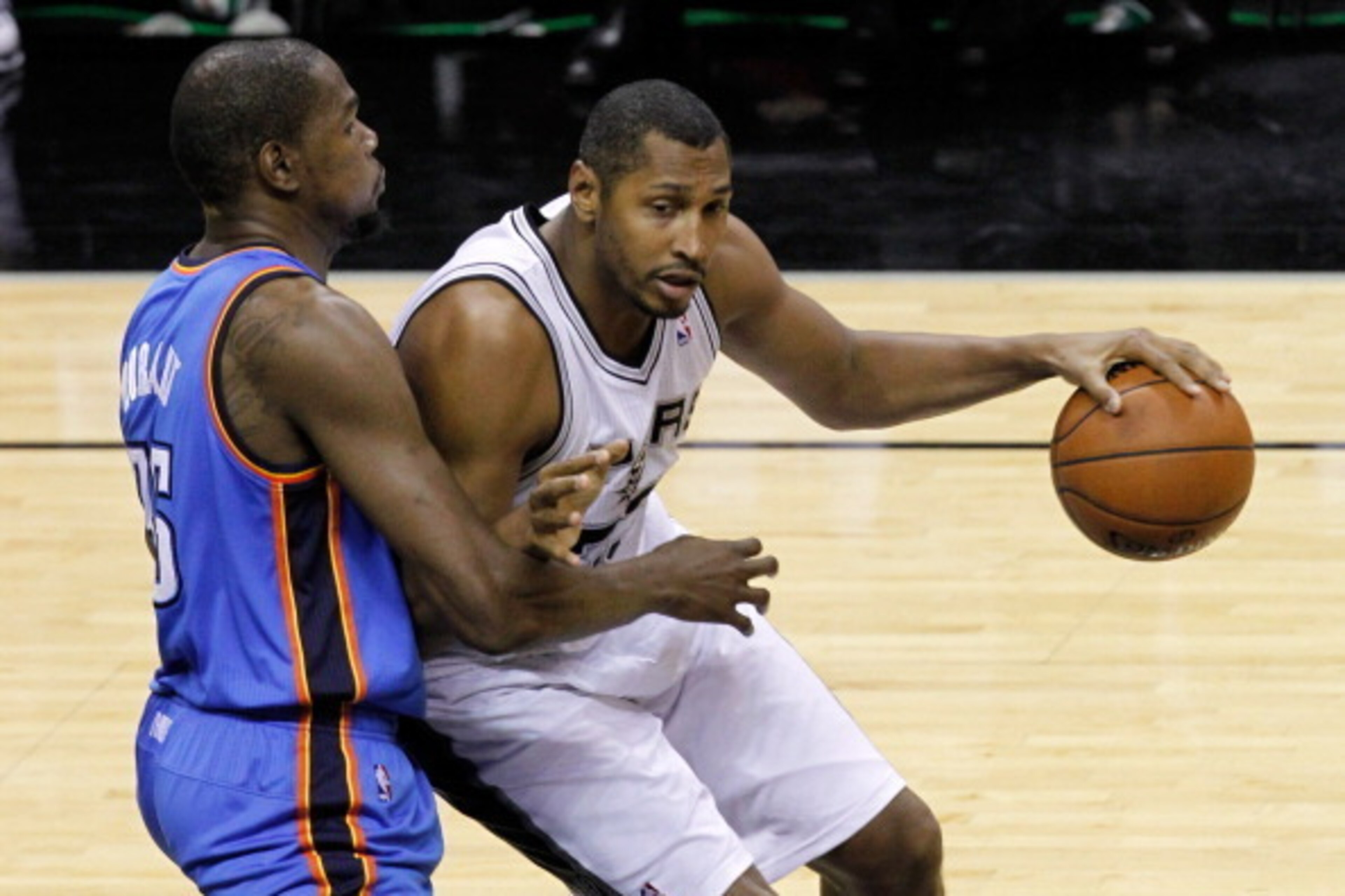 SAN ANTONIO, TX - MAY 21: Boris Diaw #33 of the San Antonio Spurs posts up Kevin Durant #35 of the Oklahoma City Thunder in the first half in Game Two of the Western Conference Finals during the 2014 NBA Playoffs at AT&T Center on May 21, 2014 in San Ant SAN ANTONIO, TX - MAY 21: Boris Diaw #33 of the San Antonio Spurs posts up Kevin Durant #35 of the Oklahoma City Thunder in the first half in Game Two of the Western Conference Finals during the 2014 NBA Playoffs at AT&T Center on May 21, 2014 in San Ant