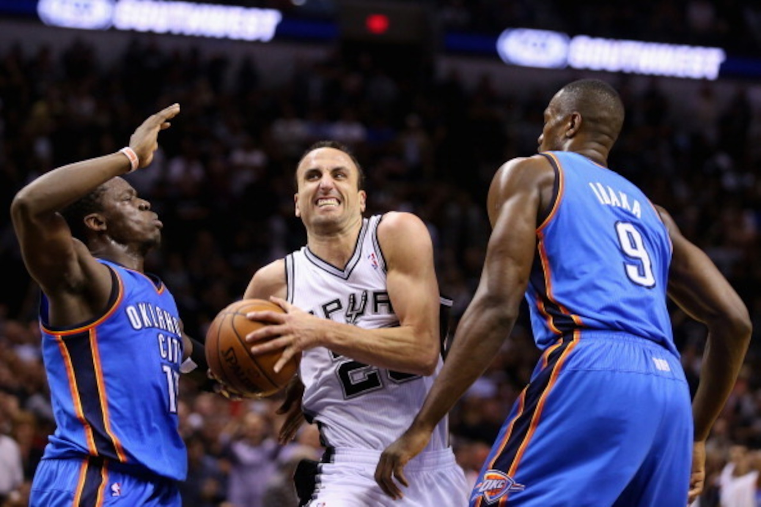 SAN ANTONIO, TX - MAY 29: Manu Ginobili #20 of the San Antonio Spurs drives to the basket against Reggie Jackson #15 and Serge Ibaka #9 of the Oklahoma City Thunder in the second quarter during Game Five of the Western Conference Finals of the 2014 NBA Pl SAN ANTONIO, TX - MAY 29: Manu Ginobili #20 of the San Antonio Spurs drives to the basket against Reggie Jackson #15 and Serge Ibaka #9 of the Oklahoma City Thunder in the second quarter during Game Five of the Western Conference Finals of the 2014 NBA Pl