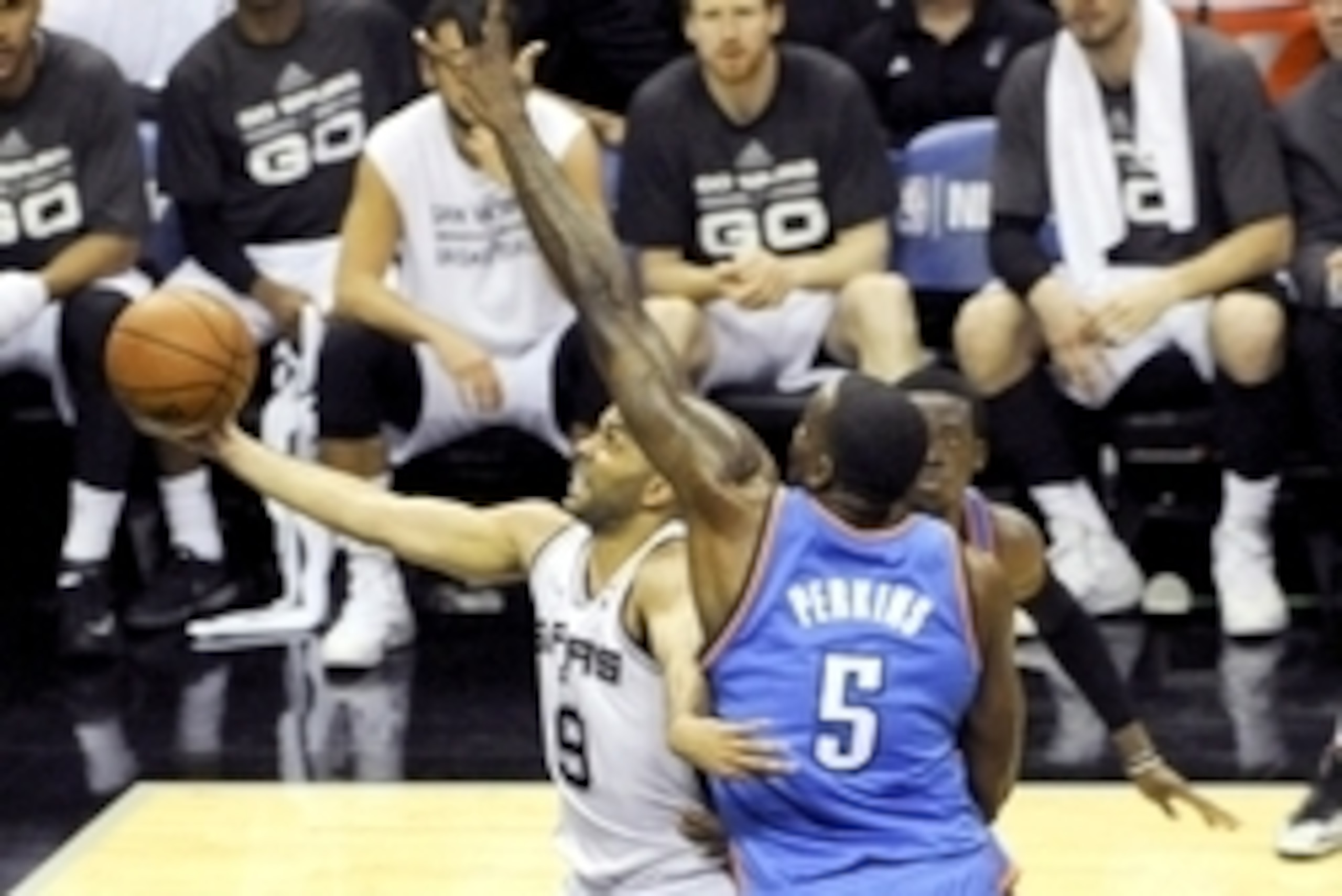 May 29, 2014; San Antonio, TX, USA; San Antonio Spurs guard Tony Parker (9) shoots past Oklahoma City Thunder center Kendrick Perkins (5) during the first half in game five of the Western Conference Finals of the 2014 NBA Playoffs at AT&T Center. Mandator May 29, 2014; San Antonio, TX, USA; San Antonio Spurs guard Tony Parker (9) shoots past Oklahoma City Thunder center Kendrick Perkins (5) during the first half in game five of the Western Conference Finals of the 2014 NBA Playoffs at AT&T Center. Mandator