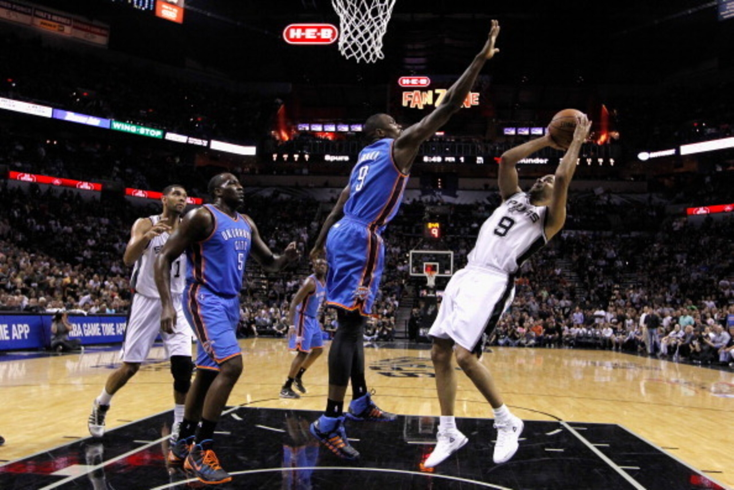 SAN ANTONIO, TX - MAY 29:  Tony Parker #9 of the San Antonio Spurs shoots against Serge Ibaka #9 of the Oklahoma City Thunder in the first half during Game Five of the Western Conference Finals of the 2014 NBA Playoffs at AT&T Center on May 29, 2014 in Sa