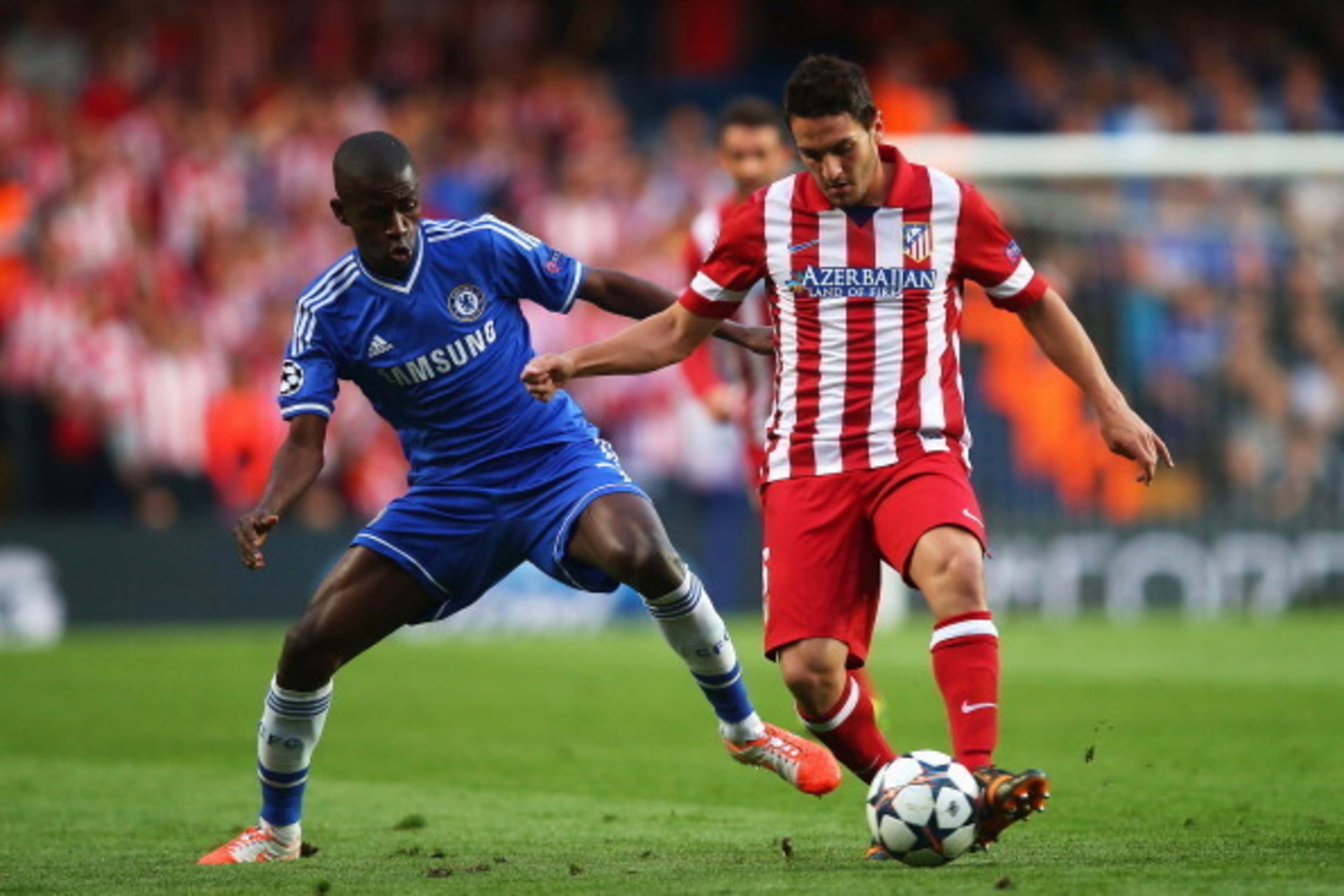 LONDON, ENGLAND - APRIL 30: Koke of Club Atletico de Madrid is tackled by Ramires of Chelsea during the UEFA Champions League semi-final second leg match between Chelsea and Club Atletico de Madrid at Stamford Bridge on April 30, 2014 in London, England. 