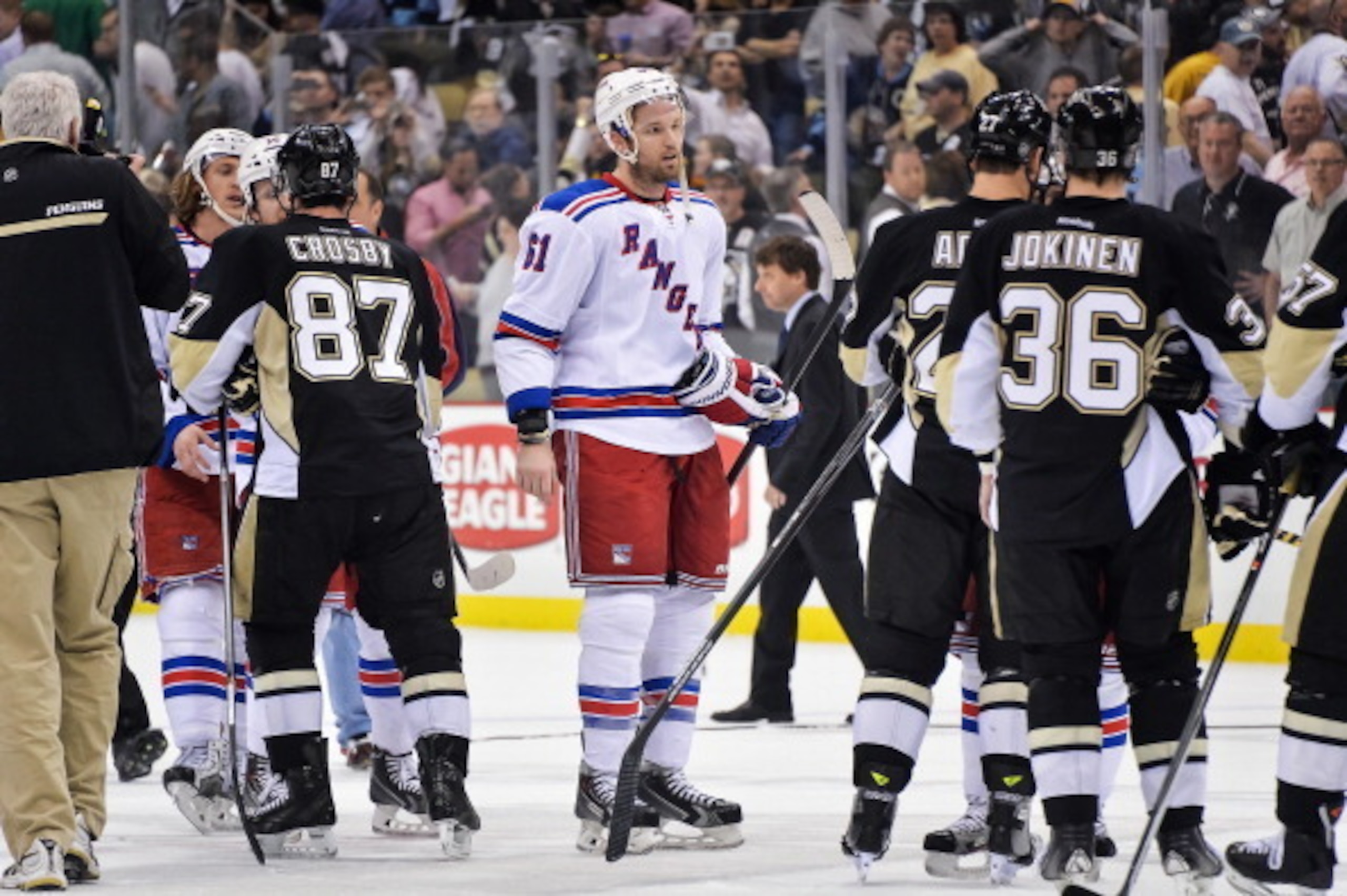 PITTSBURGH, PA - MAY 13:  Rick Nash #61 of the New York Rangers shakes hands with the Pittsburgh Penguins after Game Seven of the Second Round of the 2014 NHL Stanley Cup Playoffs on May 13, 2014 at CONSOL Energy Center in Pittsburgh, Pennsylvania.  (Phot