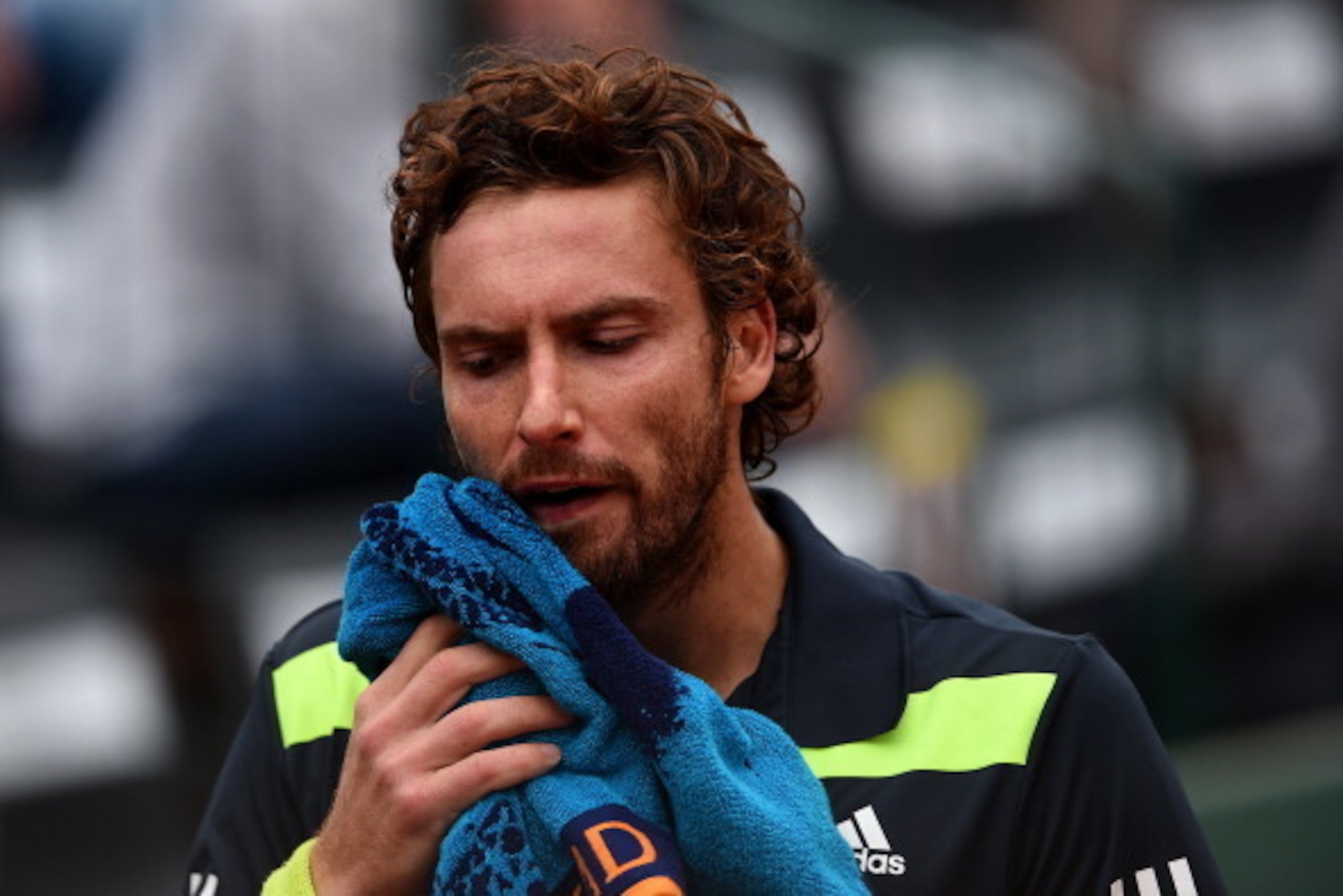 PARIS, FRANCE - MAY 30:  Ernests Gulbis of Latvia rects during his men's singles match against Radek Stepanek of Czech Republic on day six of the French Open at Roland Garros on May 30, 2014 in Paris, France.  (Photo by Matthias Hangst/Getty Images)