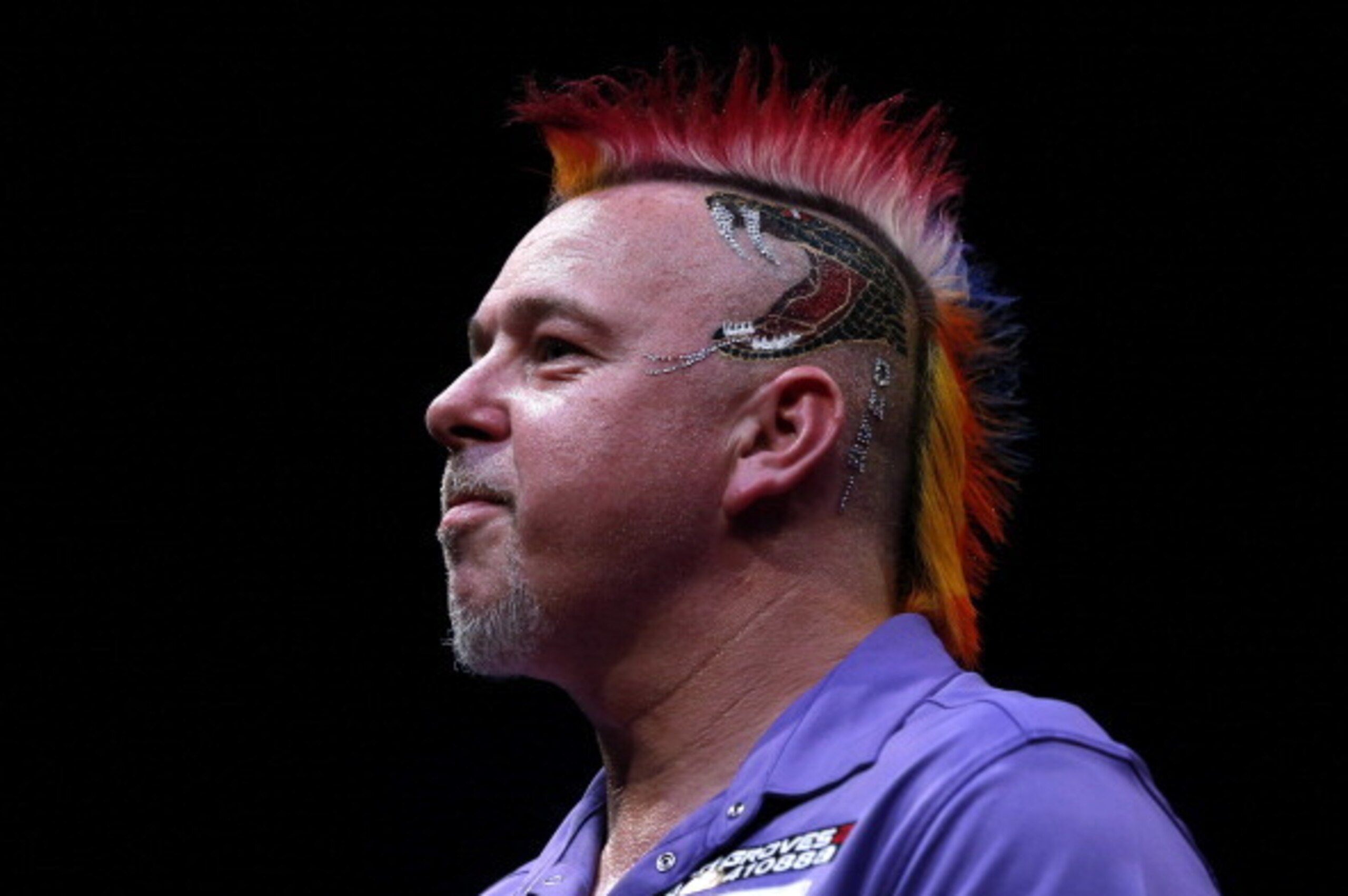 DUBAI, UNITED ARAB EMIRATES - MAY 30: Peter Wright of England celebrates after defeating Dave Chisnall of England during the 2014 Dubai Duty Free Darts Masters Semi-Final match at Dubai Duty Free Tennis Stadium, Irish Village on May 30, 2014 in Dubai, Un DUBAI, UNITED ARAB EMIRATES - MAY 30: Peter Wright of England celebrates after defeating Dave Chisnall of England during the 2014 Dubai Duty Free Darts Masters Semi-Final match at Dubai Duty Free Tennis Stadium, Irish Village on May 30, 2014 in Dubai, Un