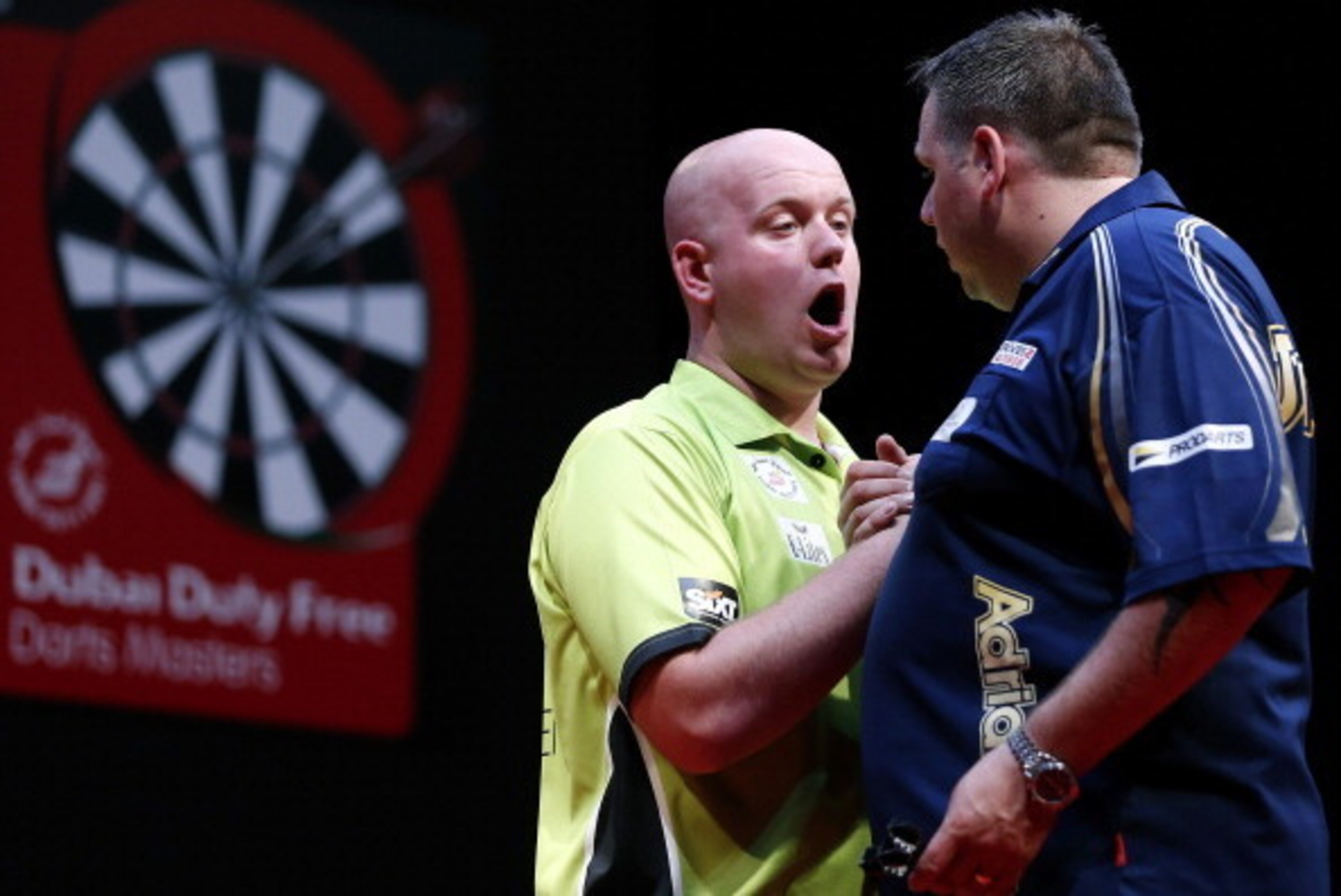 DUBAI, UNITED ARAB EMIRATES - MAY 30:  Michael Van Grewen (L) of the Netherlands is congraulated by Adrian Lewis (R) of England after winning the 2014 Dubai Duty Free Darts Masters Semi-Final match at Dubai Duty Free Tennis Stadium, Irish Village on May 3