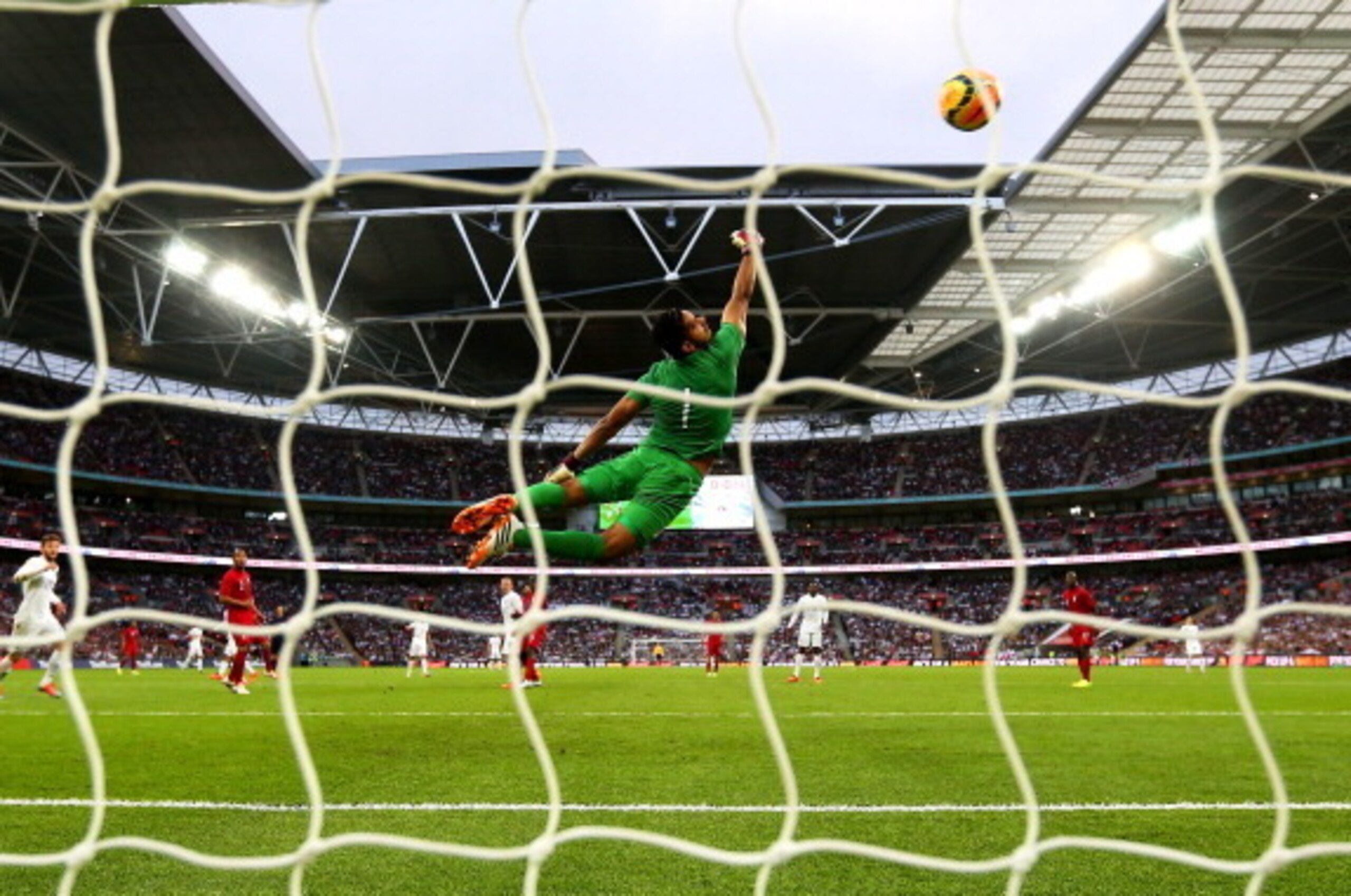 LONDON, ENGLAND - MAY 30:  Raul Fernandez of Peru fails to stop Daniel Sturridge of England (not pictured) scoring the opening goal during the international friendly match between England and Peru at Wembley Stadium on May 30, 2014 in London, England.  (P