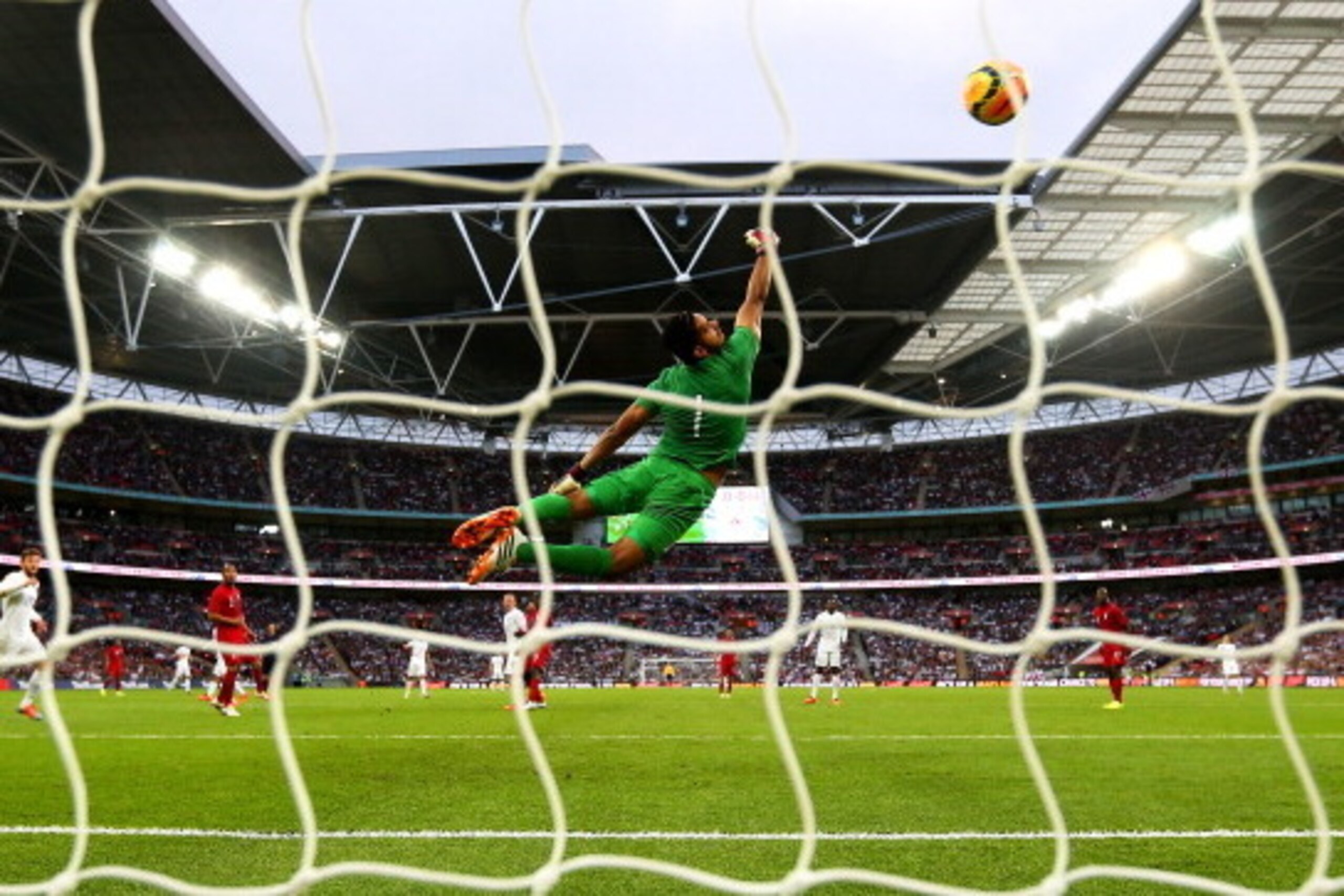 LONDON, ENGLAND - MAY 30:  Raul Fernandez of Peru fails to stop Daniel Sturridge of England (not pictured) scoring the opening goal during the international friendly match between England and Peru at Wembley Stadium on May 30, 2014 in London, England.  (P