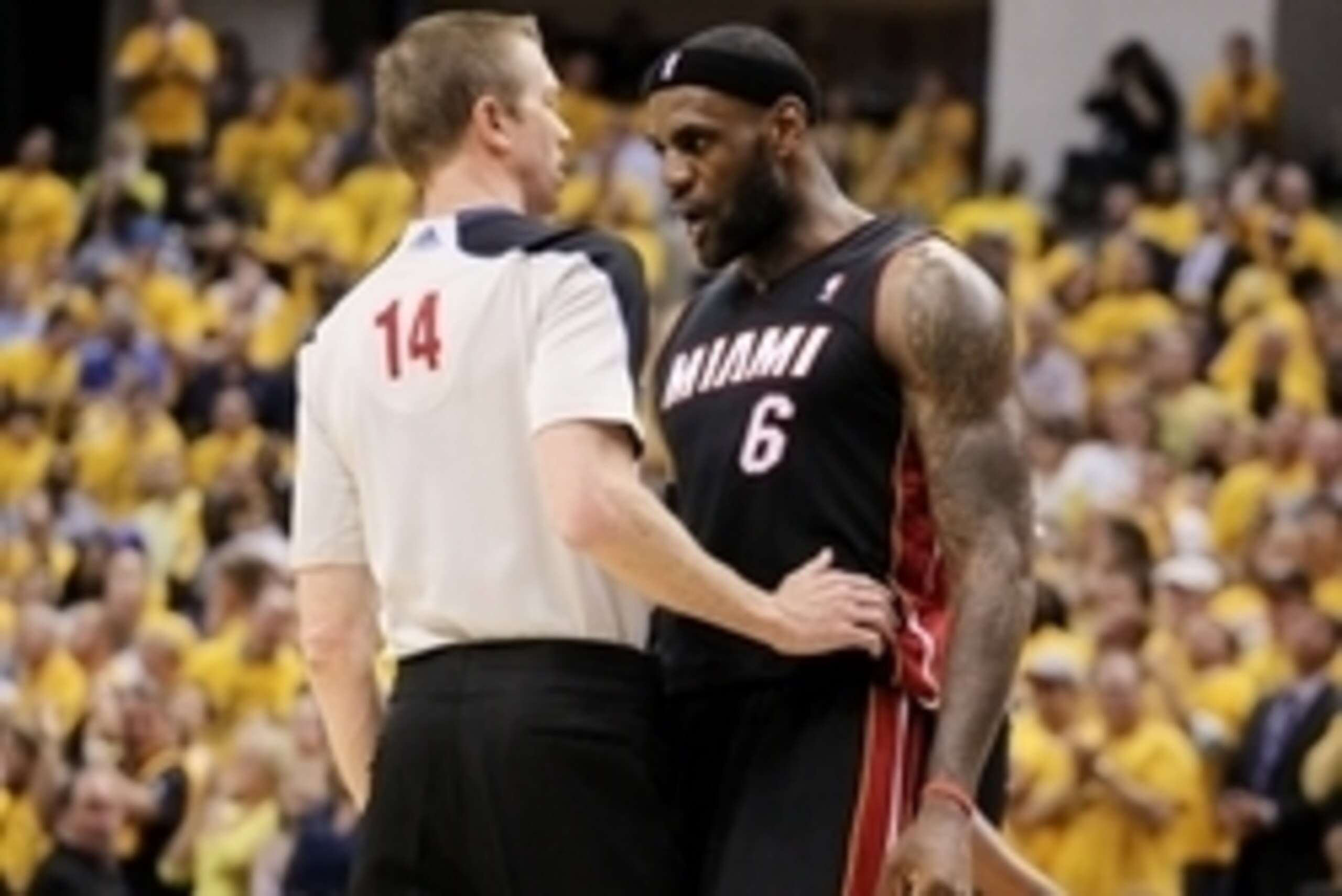 May 28, 2014; Indianapolis, IN, USA; Game referee Ed Malloy (14) and Miami Heat forward LeBron James (6) exchange words during the fourth quarter in game five against the Indiana Pacers of the Eastern Conference Finals of the 2014 NBA Playoffs at Bankers 