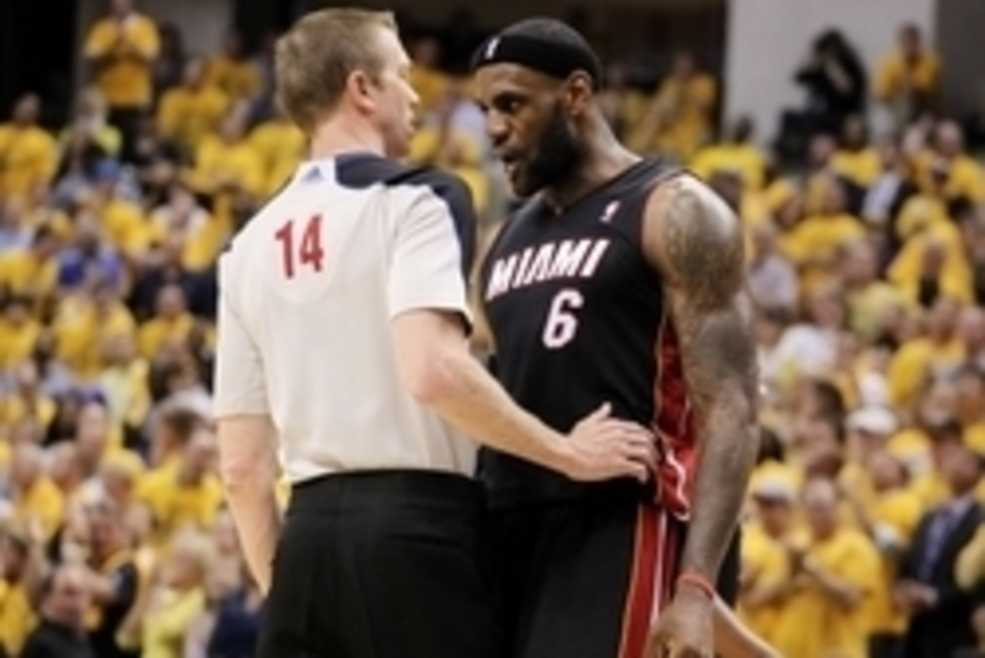 May 28, 2014; Indianapolis, IN, USA; Game referee Ed Malloy (14) and Miami Heat forward LeBron James (6) exchange words during the fourth quarter in game five against the Indiana Pacers of the Eastern Conference Finals of the 2014 NBA Playoffs at Bankers 