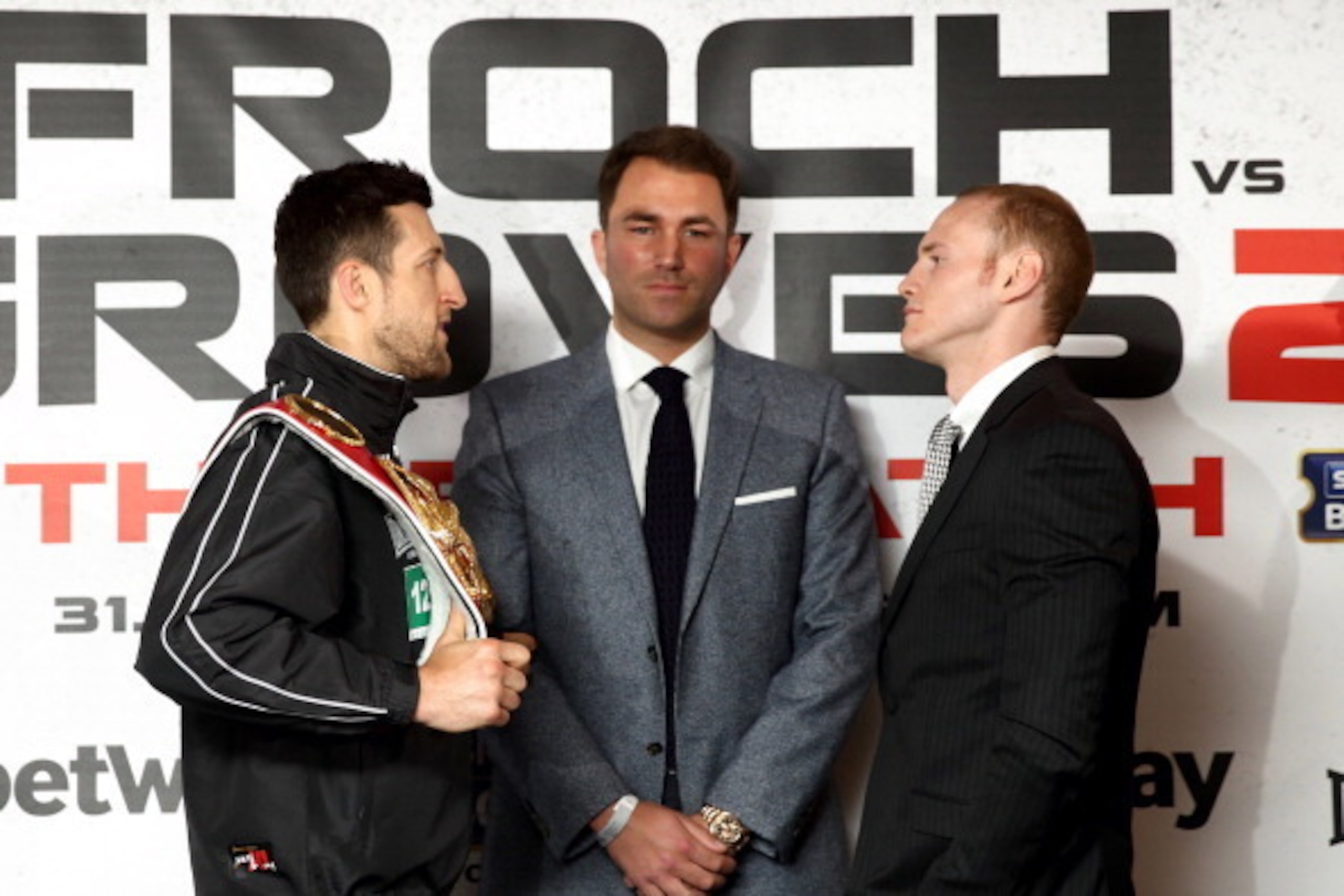 LONDON, ENGLAND - MAY 29: Promoter Eddie Hearn stands inbetween Carl Froch and George Groves as they go head to head during a press conference to announce the upcoming WBA & IBF Super Middleweight World Championship fight between Carl Froch and George Gr LONDON, ENGLAND - MAY 29: Promoter Eddie Hearn stands inbetween Carl Froch and George Groves as they go head to head during a press conference to announce the upcoming WBA & IBF Super Middleweight World Championship fight between Carl Froch and George Gr