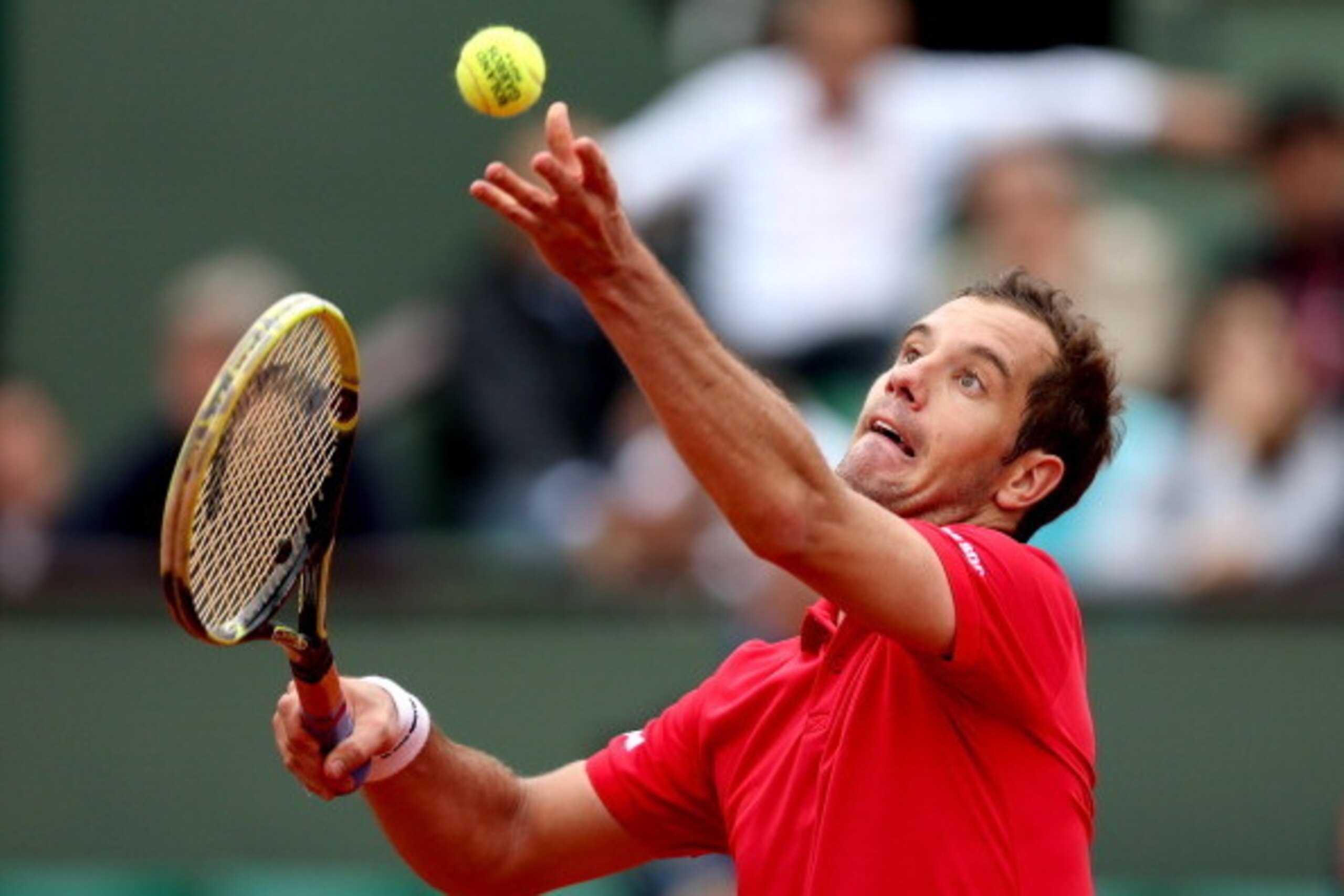 PARIS, FRANCE - MAY 29:  Richard Gasquet of France serves during his men's singles match against Carlos Berlocq of Argentina on day five of the French Open at Roland Garros on May 29, 2014 in Paris, France.  (Photo by Matthew Stockman/Getty Images)