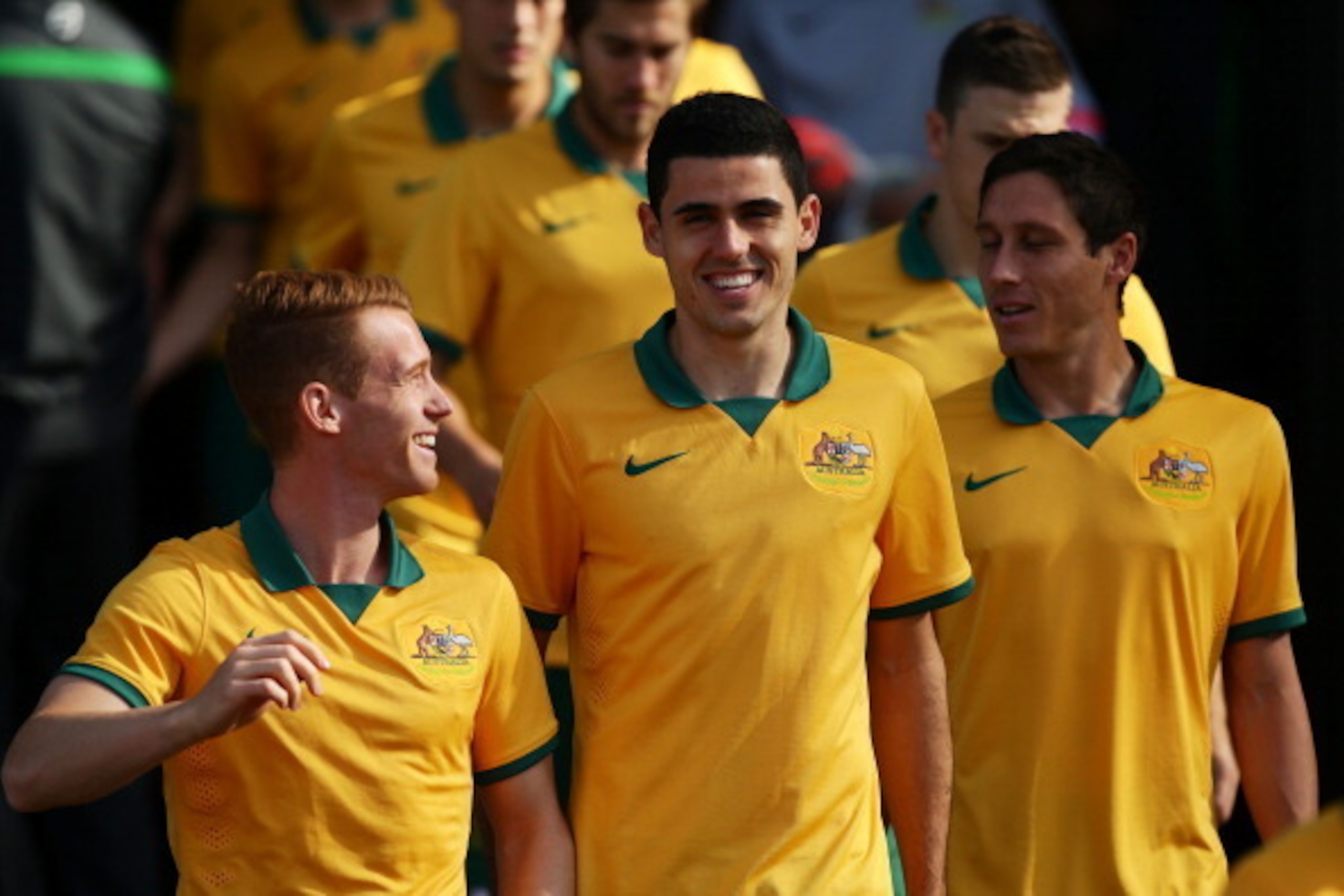SYDNEY, AUSTRALIA - MAY 23:  (L-R) Oliver Bozanic, Tom Rogic and Mark Milligan walk out for the team photo during the Australian Socceroos World Cup Squad official team photo session at WIN Jubilee Stadium on May 23, 2014 in Sydney, Australia.  (Photo by 