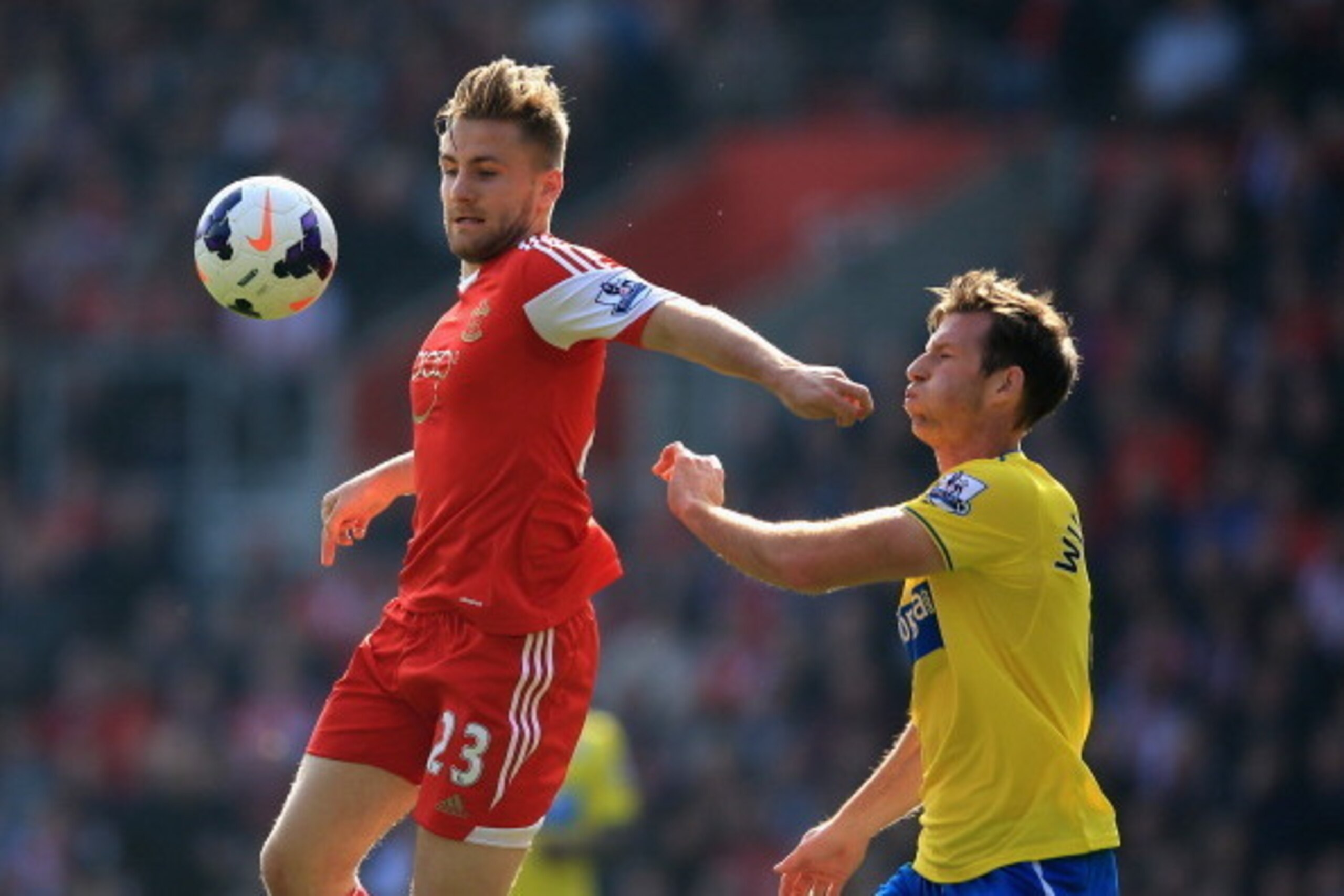 SOUTHAMPTON, ENGLAND - MARCH 29:  Luke Shaw of Southampton controls the ball under pressure from Michael Williamson of Newcastle United during the Barclays Premier League match between Southampton and Newcastle United at the St Mary's Stadium on March 29,