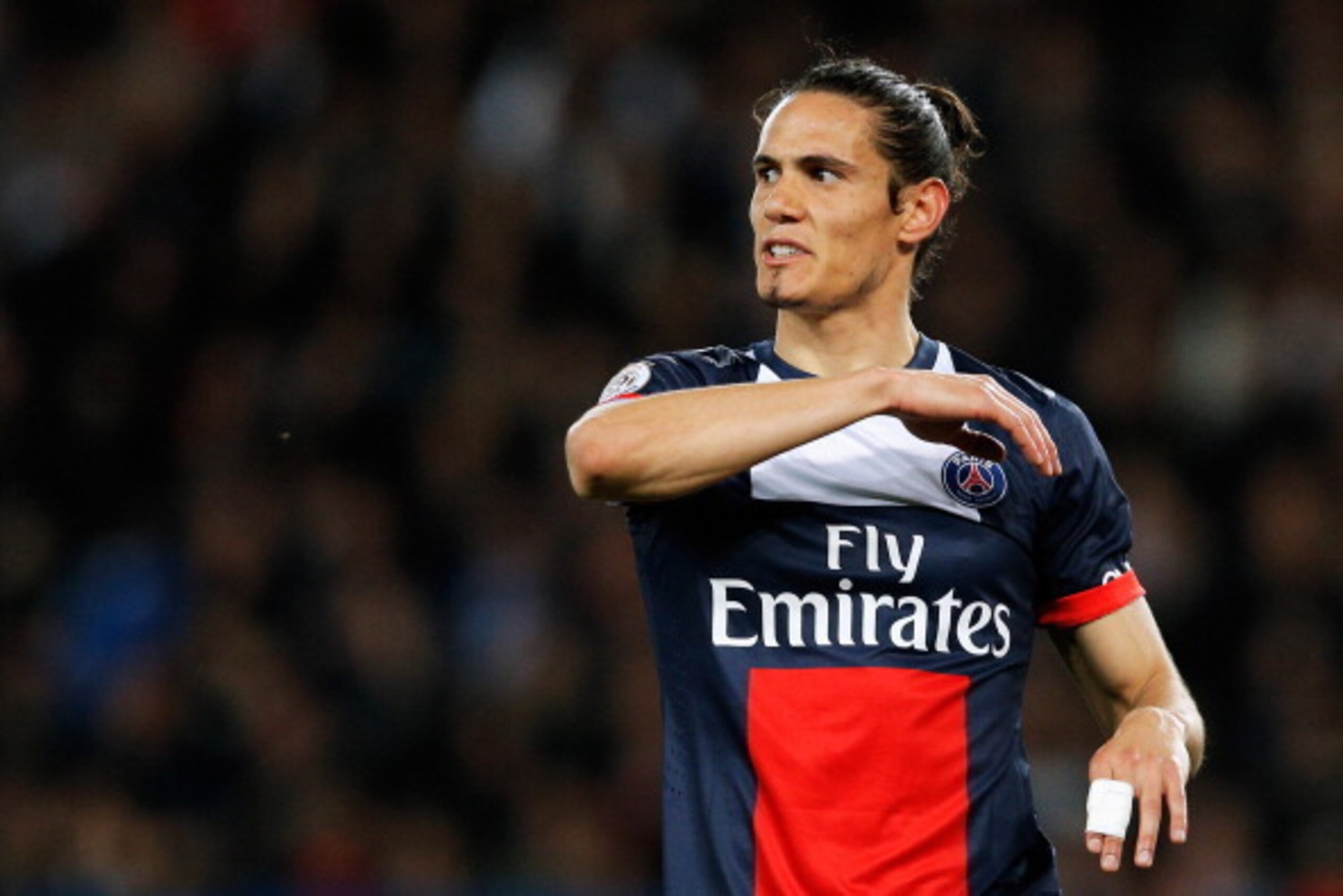 PARIS, FRANCE - MAY 07:  Edinson Cavani of PSG reacts to a missed chance on goal during the Ligue 1 match between Paris Saint-Germain FC and Stade Rennais FC at Parc des Princes on May 7, 2014 in Paris, France.  (Photo by Dean Mouhtaropoulos/Getty Images)