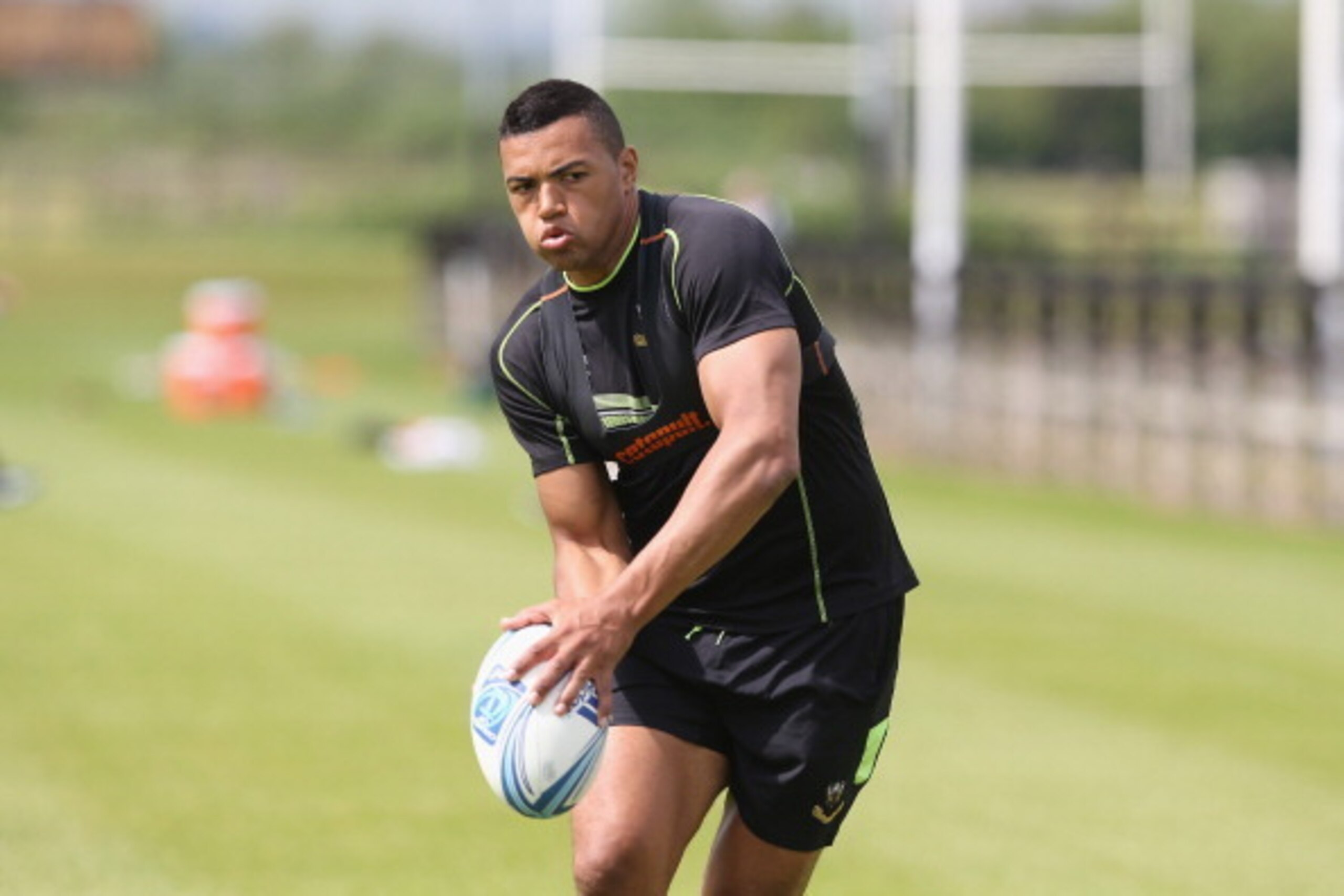 NORTHAMPTON, ENGLAND - MAY 20:  Luther Burrell runs with the ball during the Northampton Saints training session held at Franklin's Gardens on May 20, 2014 in Northampton, England.  (Photo by David Rogers/Getty Images)