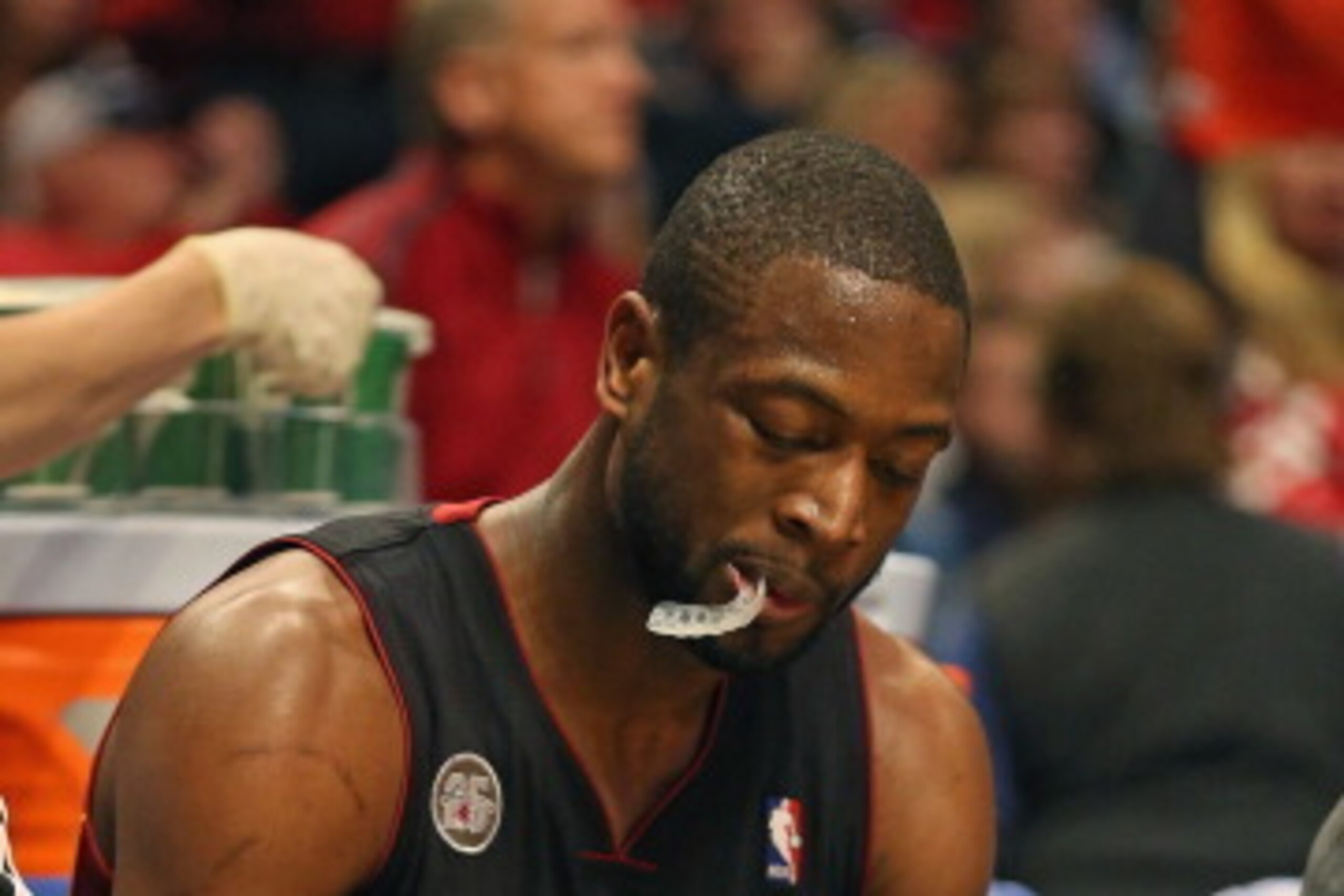 CHICAGO, IL - MAY 13: Dwyane Wade #3 of the Miami Heat rubs his knee as he sits on the bench during a break against the Chicago Bulls in Game Four of the Eastern Conference Semifinals during the 2013 NBA Playoffs at the United Center on May 13, 2013 in Ch CHICAGO, IL - MAY 13: Dwyane Wade #3 of the Miami Heat rubs his knee as he sits on the bench during a break against the Chicago Bulls in Game Four of the Eastern Conference Semifinals during the 2013 NBA Playoffs at the United Center on May 13, 2013 in Ch