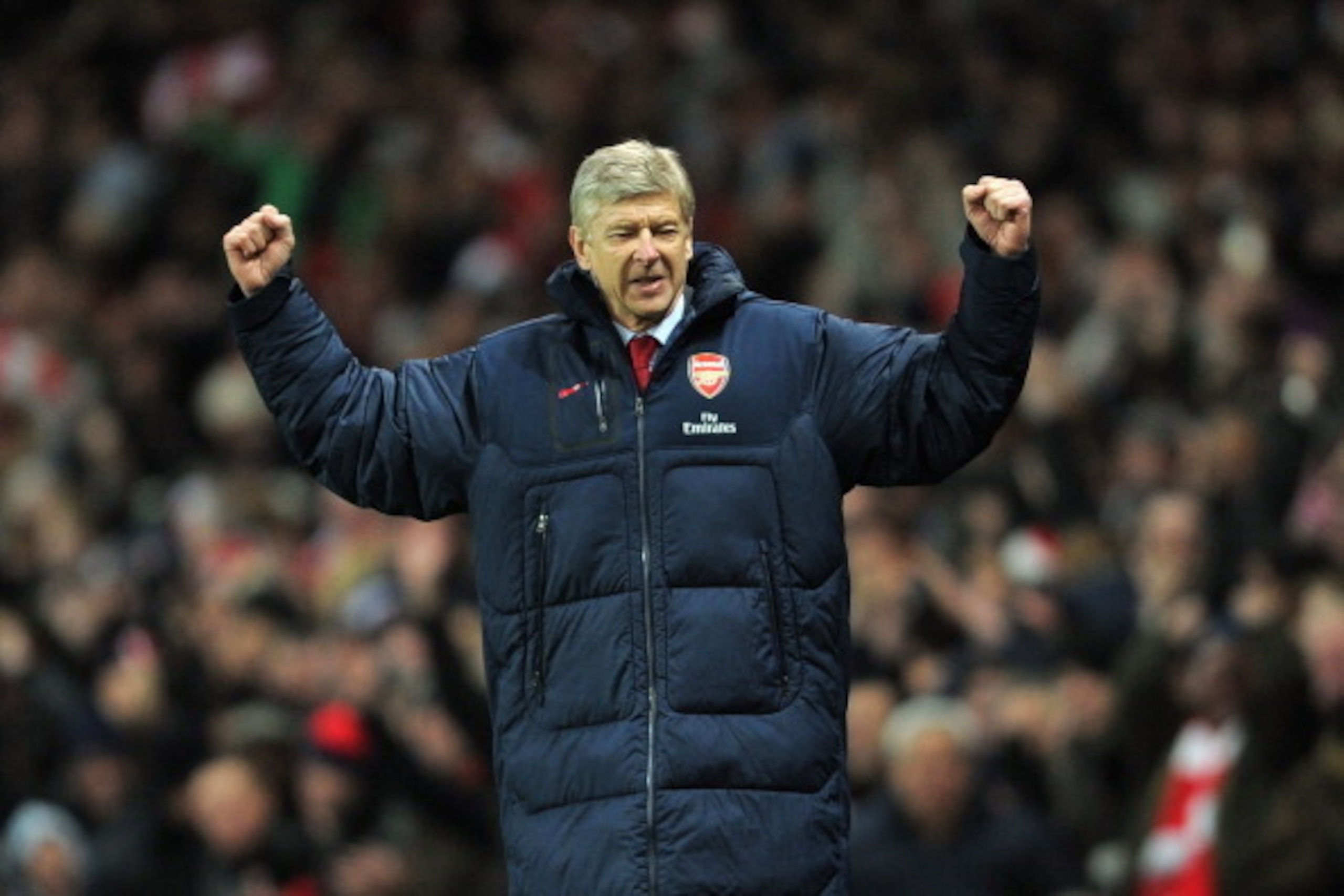 LONDON, ENGLAND - DECEMBER 10:  Manager Arsene Wenger of Arsenal celebrates as Robin van Persie of Arsenal scores the opening goal during the Barclays Premier League match between Arsenal and Everton at Emirates Stadium on December 10, 2011 in London, Eng