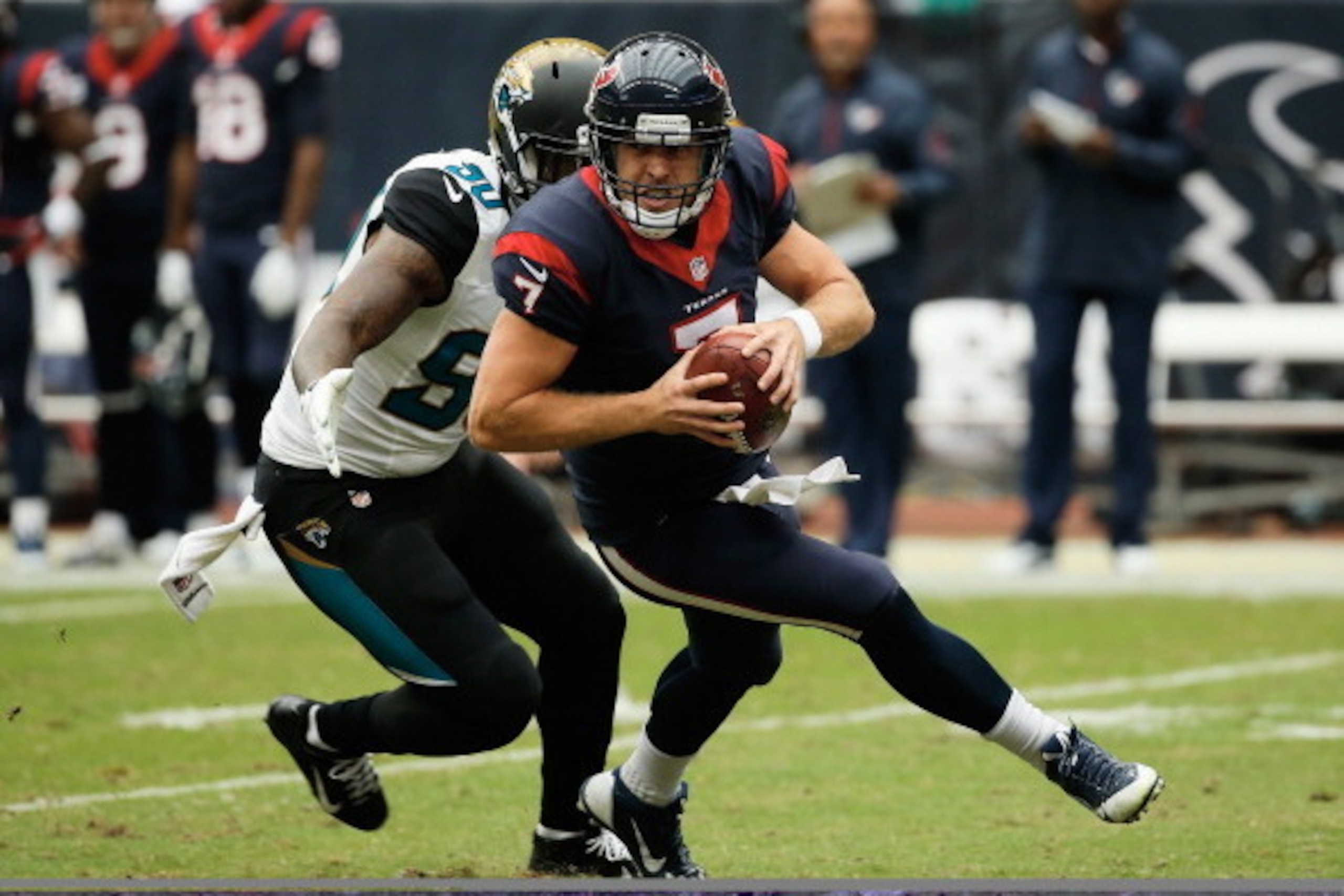 HOUSTON, TX - NOVEMBER 24:  Case Keenum #7 of the Houston Texans is sacked by Andre Branch #90 of the Jacksonville Jaguars  in the first half at Reliant Stadium on November 24, 2013 in Houston, Texas.  (Photo by Scott Halleran/Getty Images)